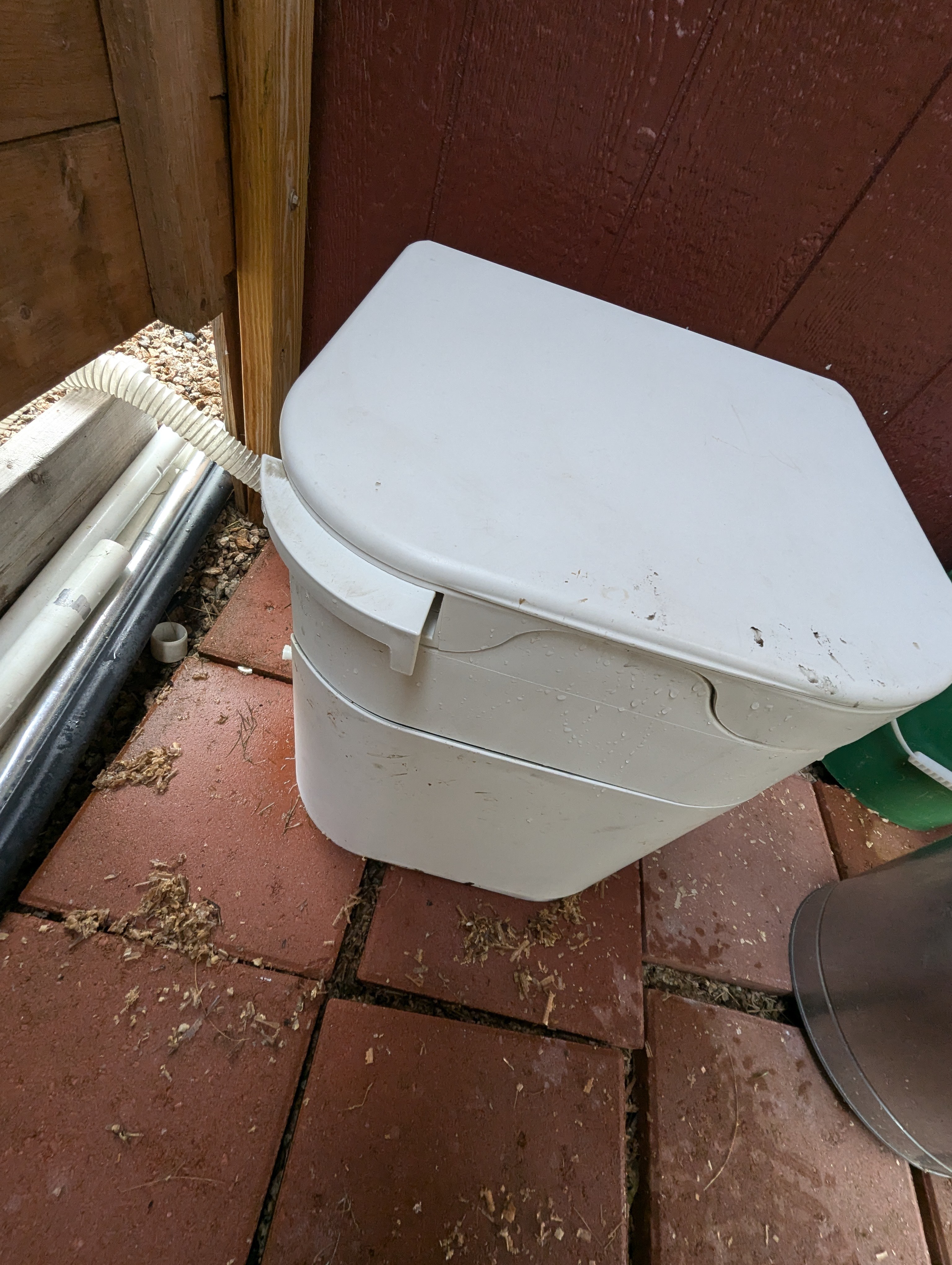 OGO composting toilet. Pull lever out to open the hole