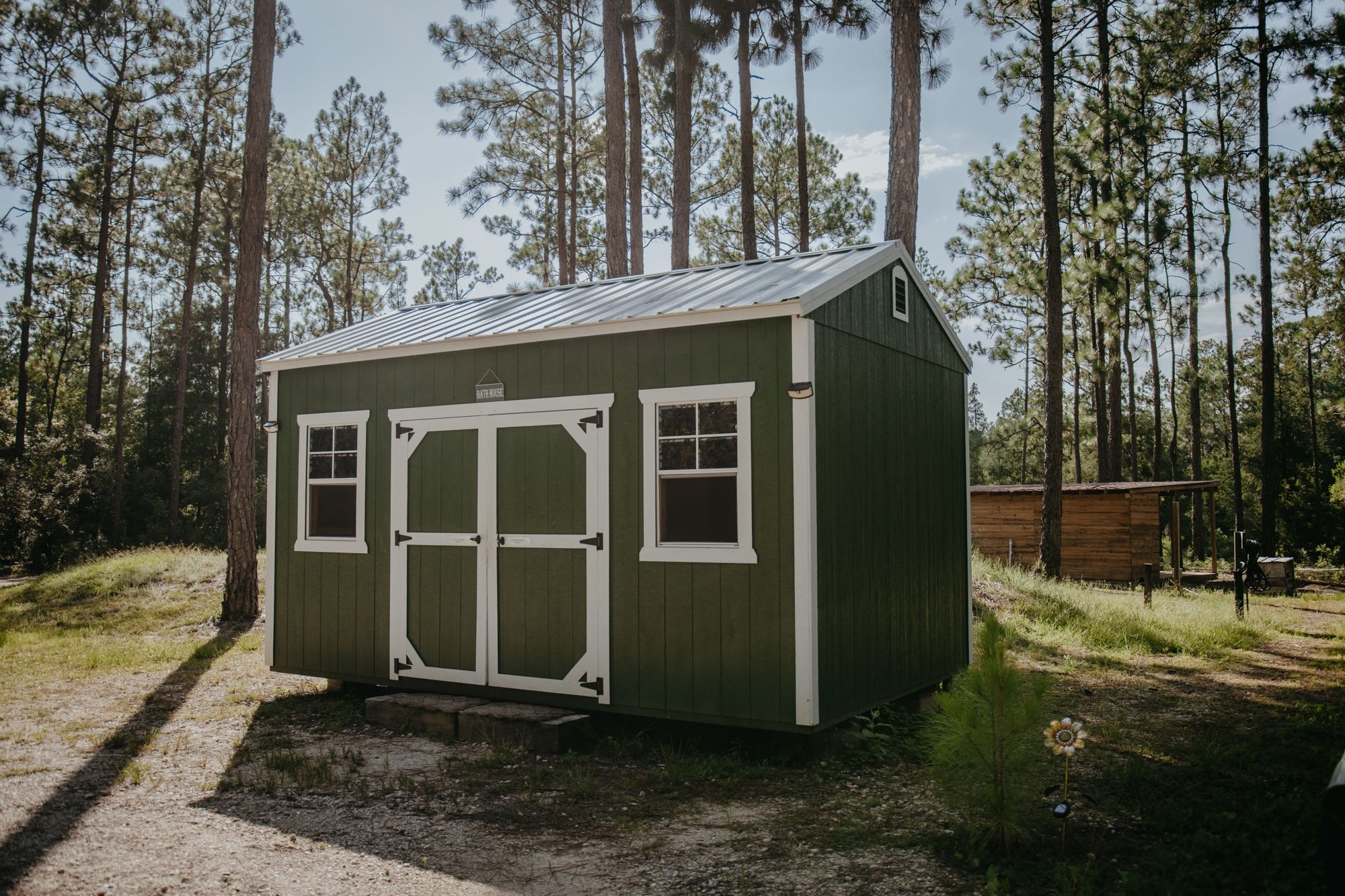 The communal bathhouse with the camp kitchen in the background.