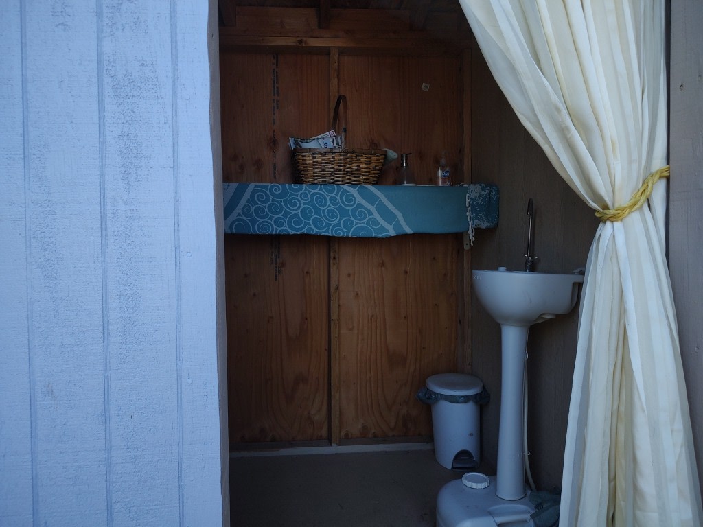 This is Tiny Cabin #1.  It's located closer to the house and the other side of the game/dining #2 area. 

TC #1 has recently been painted,  new outdoor chair cushions, rug and cafe lights.  Plus, an attached bathroom with a portable sink and potty. 