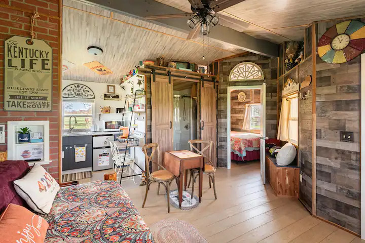 View of main living area, kitchenette, bathroom and separate bedroom.