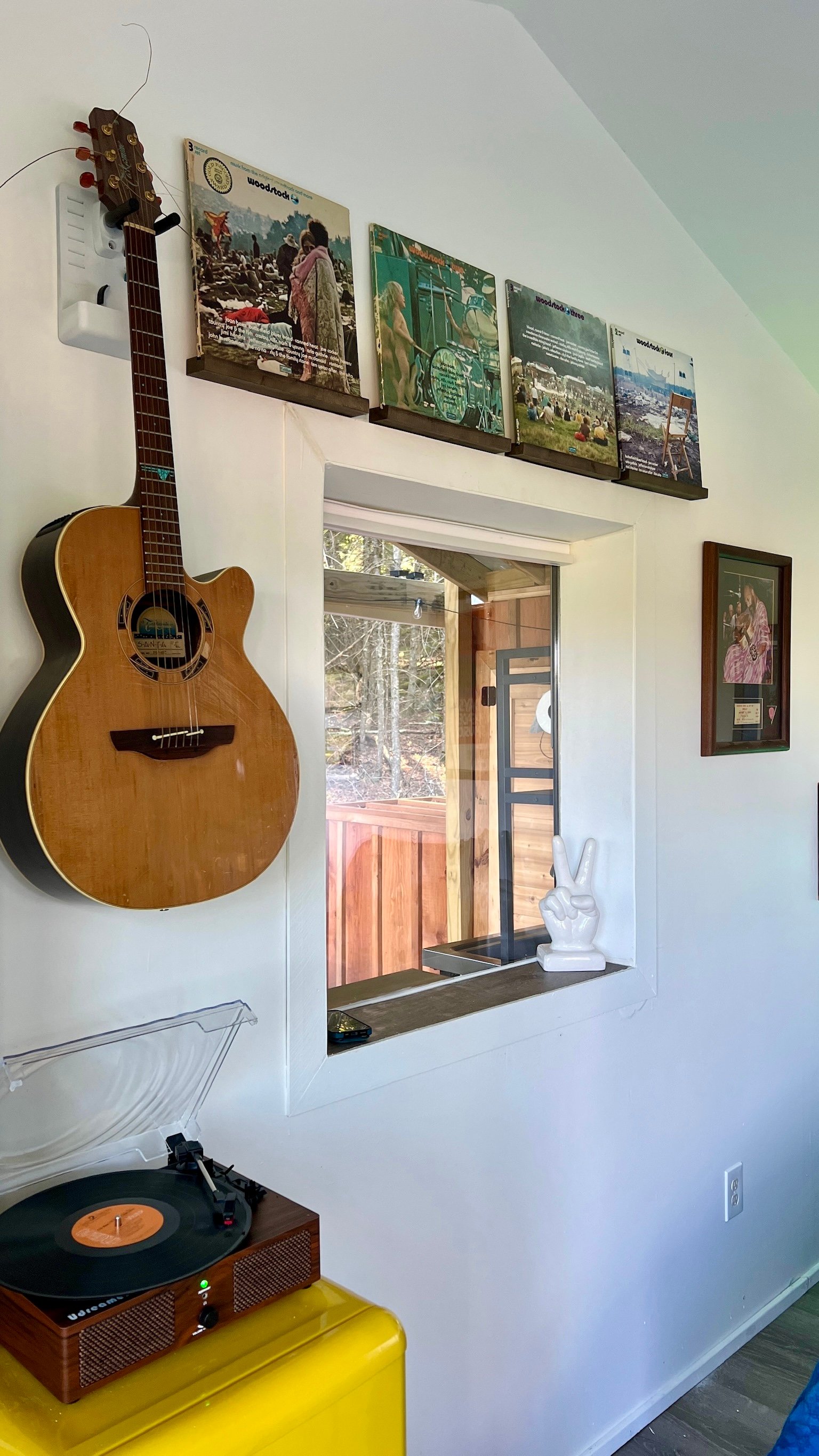 Guitar, record player and mini fridge with freezer