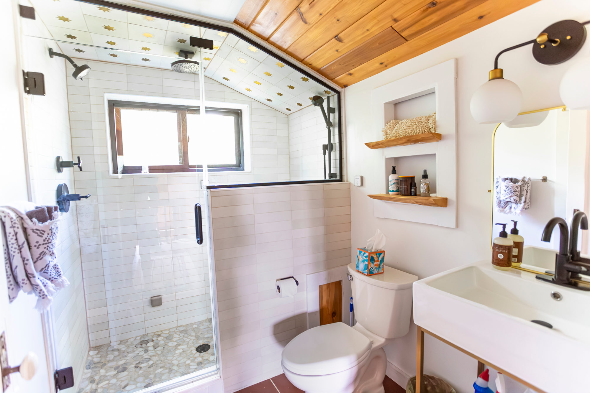 Up stairs bathroom with steam and multiple shower heads