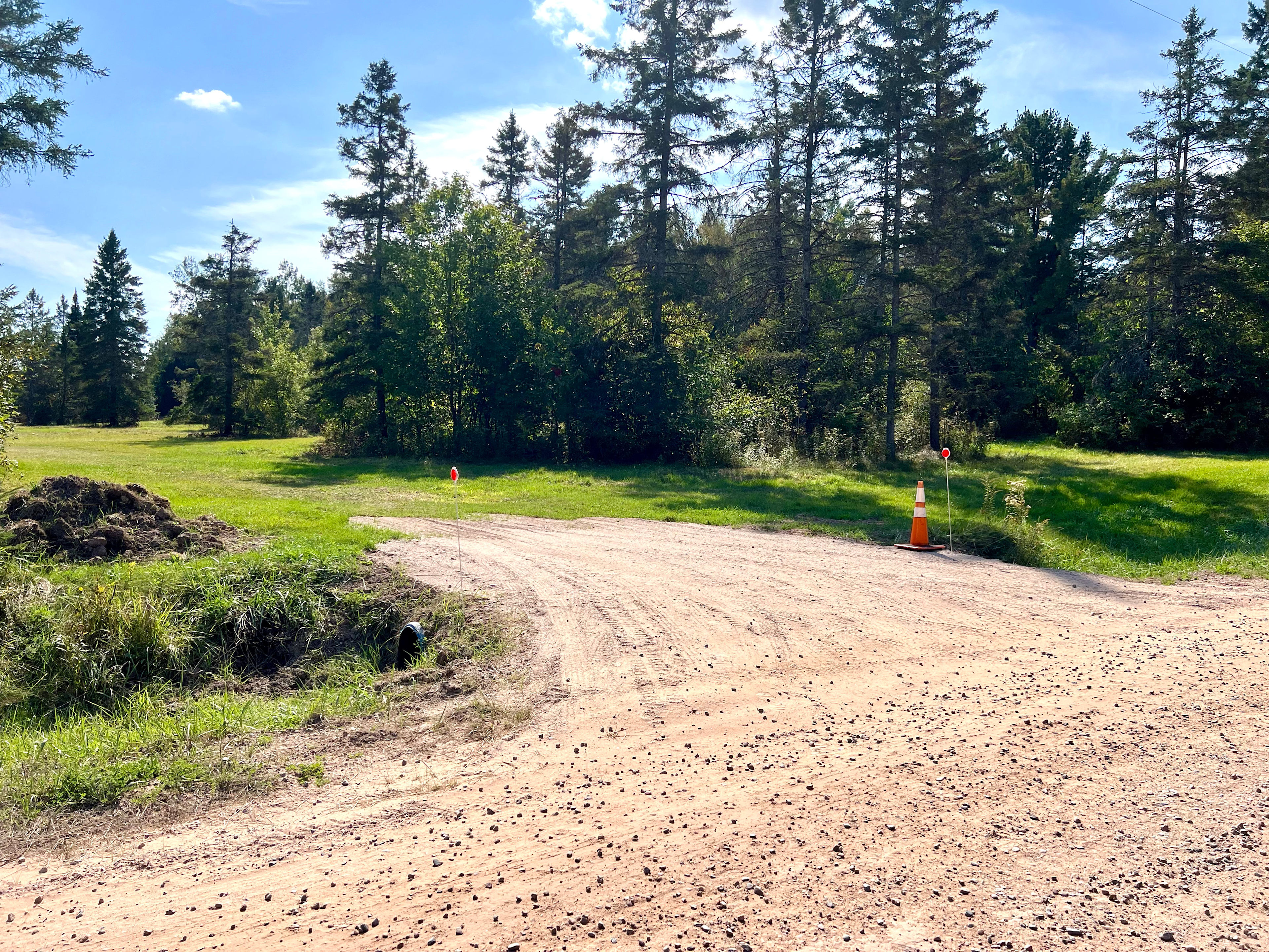New Driveway and entrance on the south side of 12 Mile Rd. 100 yards west of the bridge.