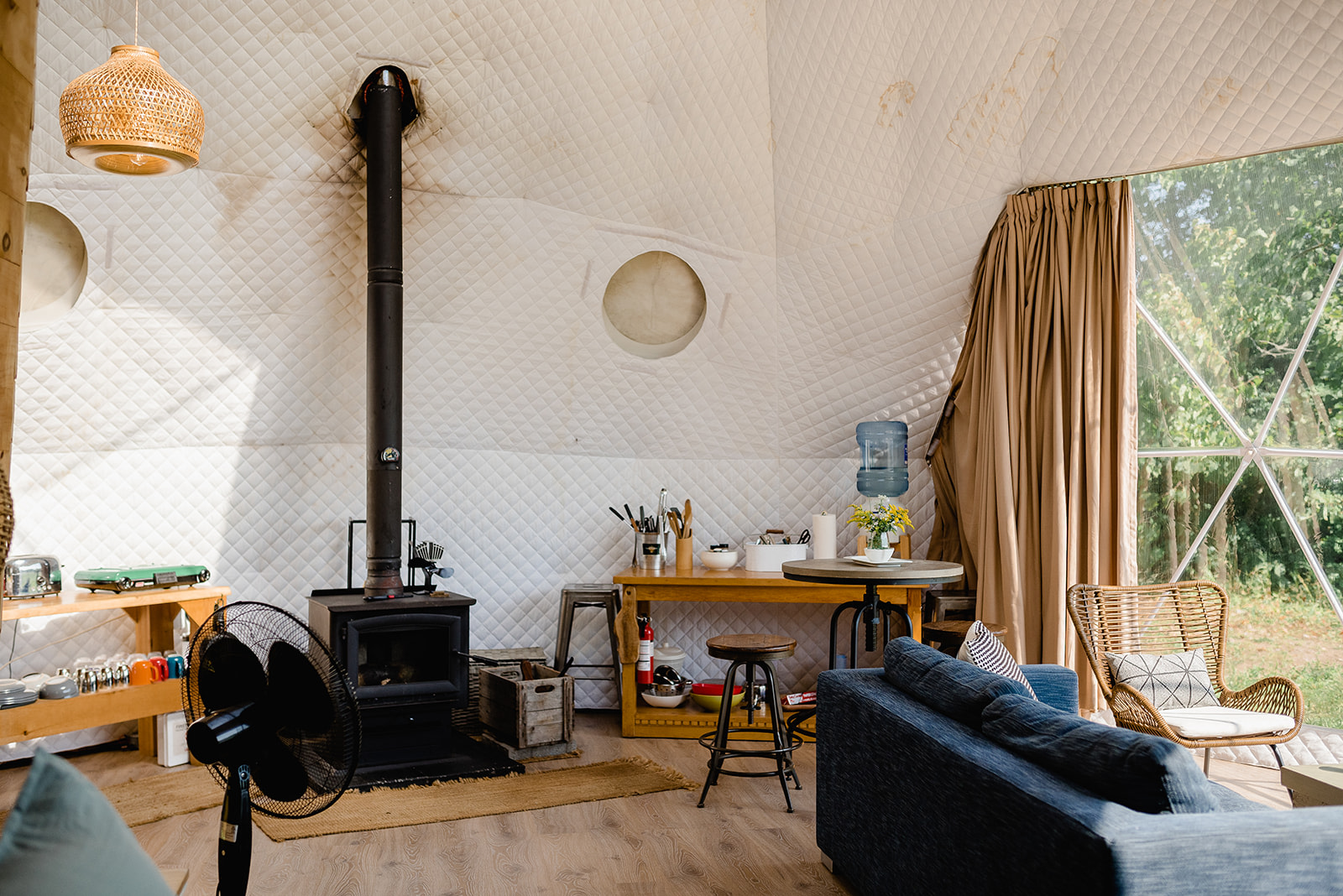 Sky-View interior. Sofa, wood-burning stove, kitchenette
