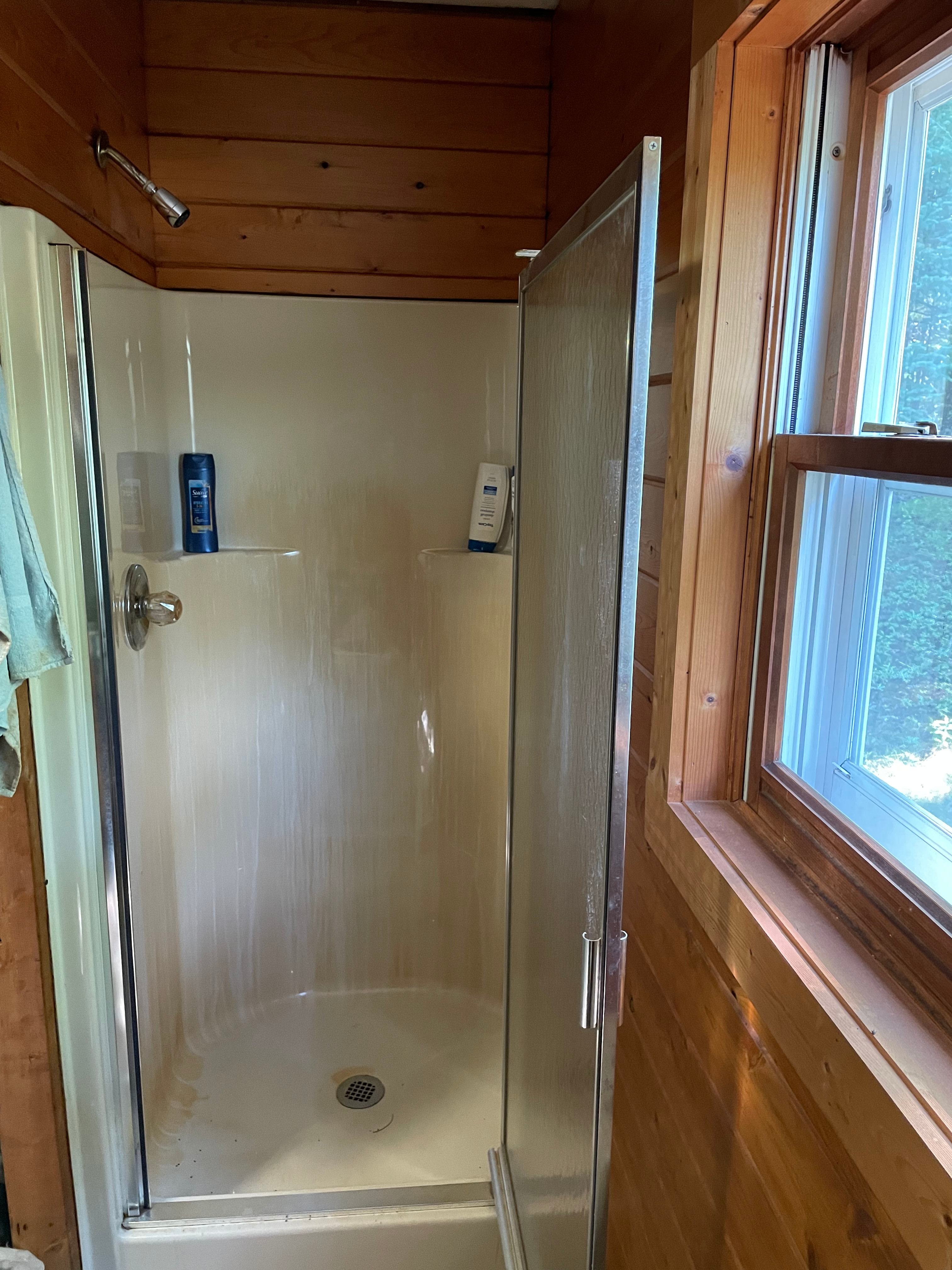 There is a fully functional stand up shower with hot and cold running water.