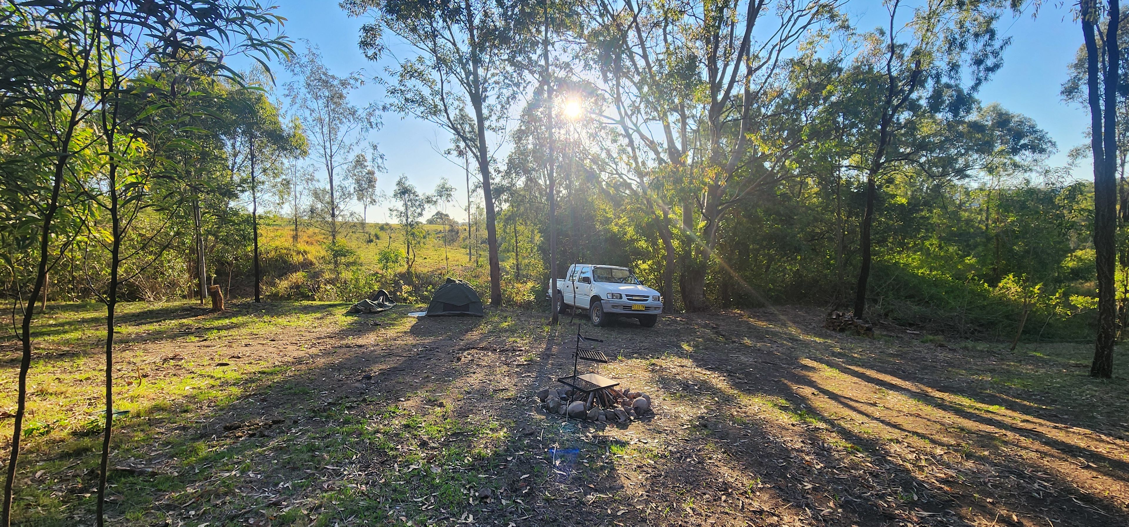 This secluded and spacious campsite catches glimpses of the afternoon sun through the  tree tops that surround it. 

Suitable for groups of up to 10 adults. 