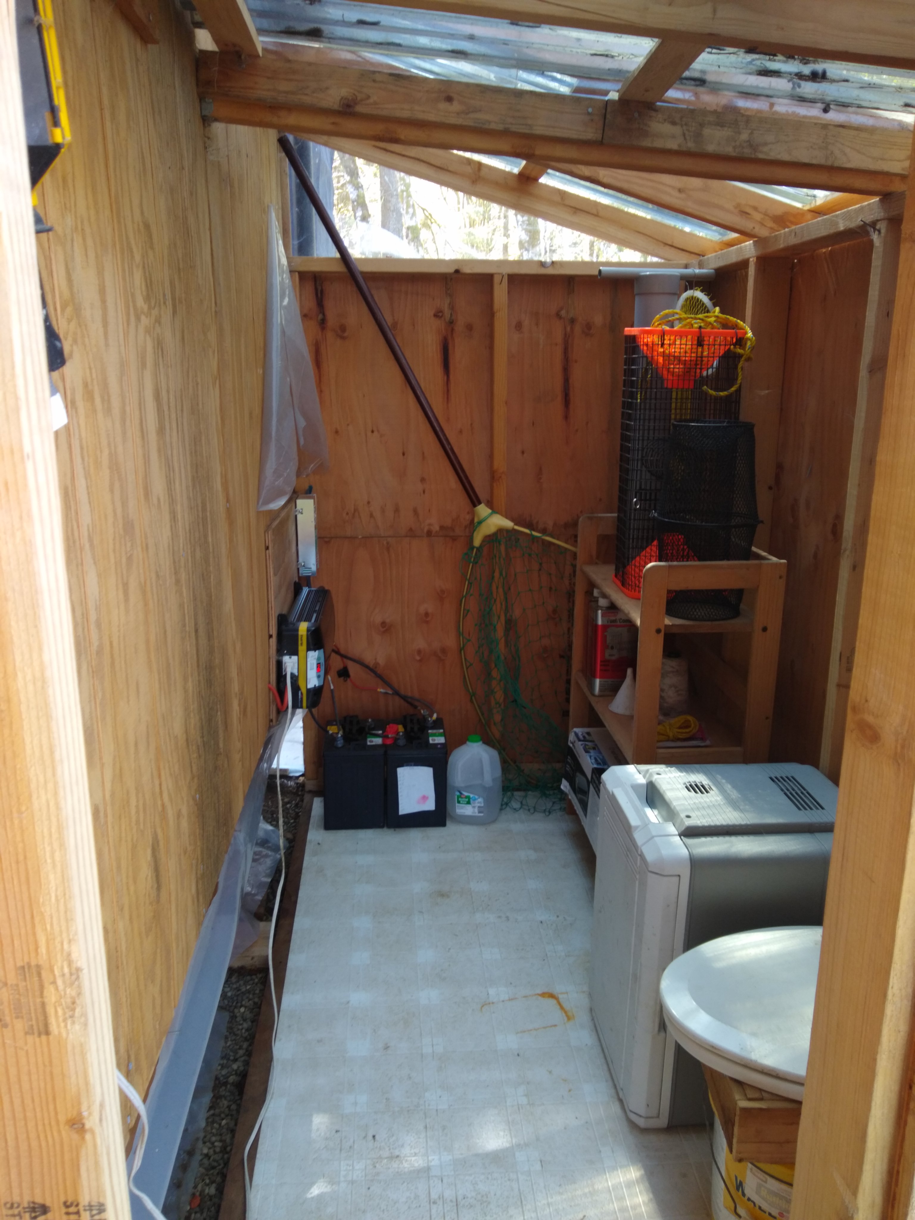 Utility shed with electrical outlet, electric cooler and compost toilet.  