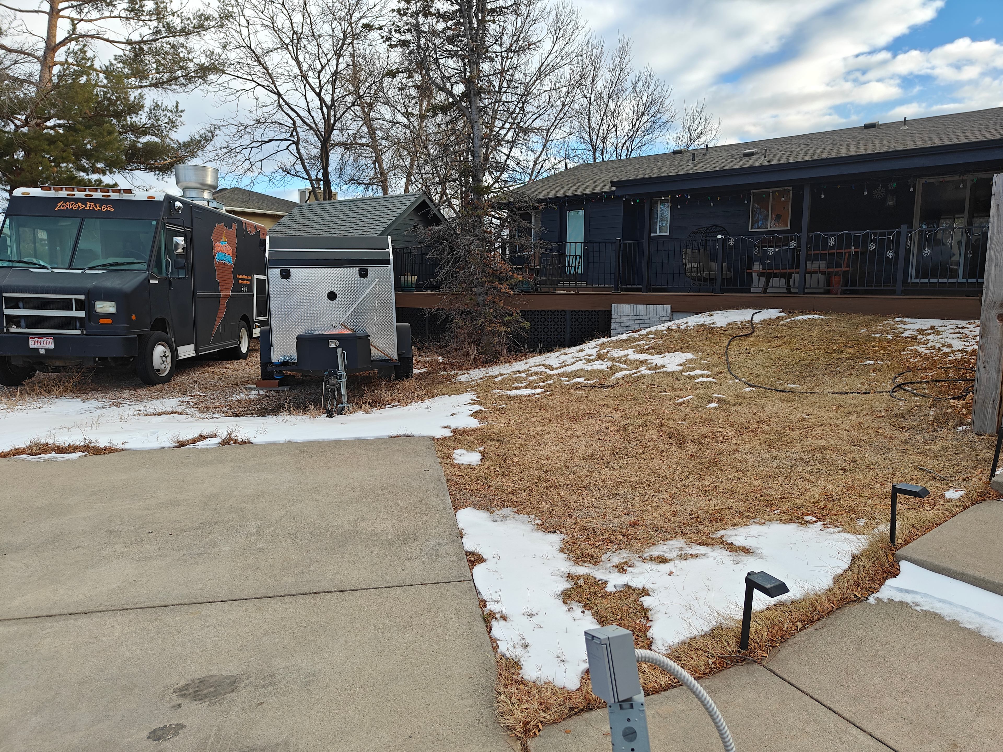 The private yard is behind the shed with an entrance directly to the left. The food truck and trailer will be leaving the property soon, allowing more room for guests.
