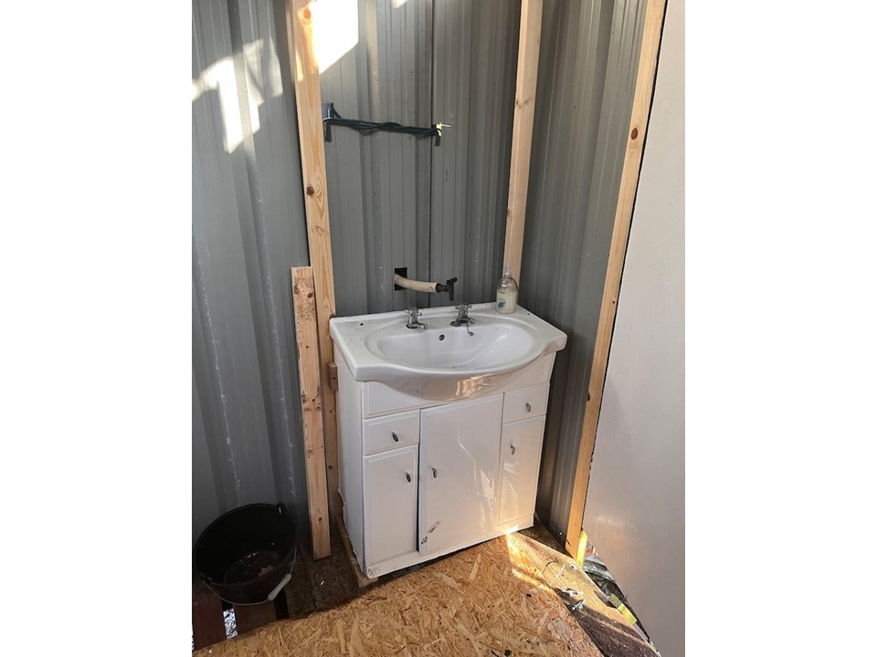 Cold water sink in compost toilet block