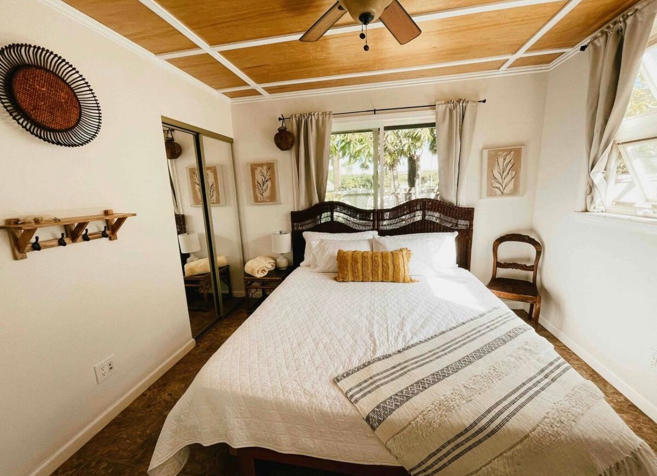 King bedroom with door to exit home 