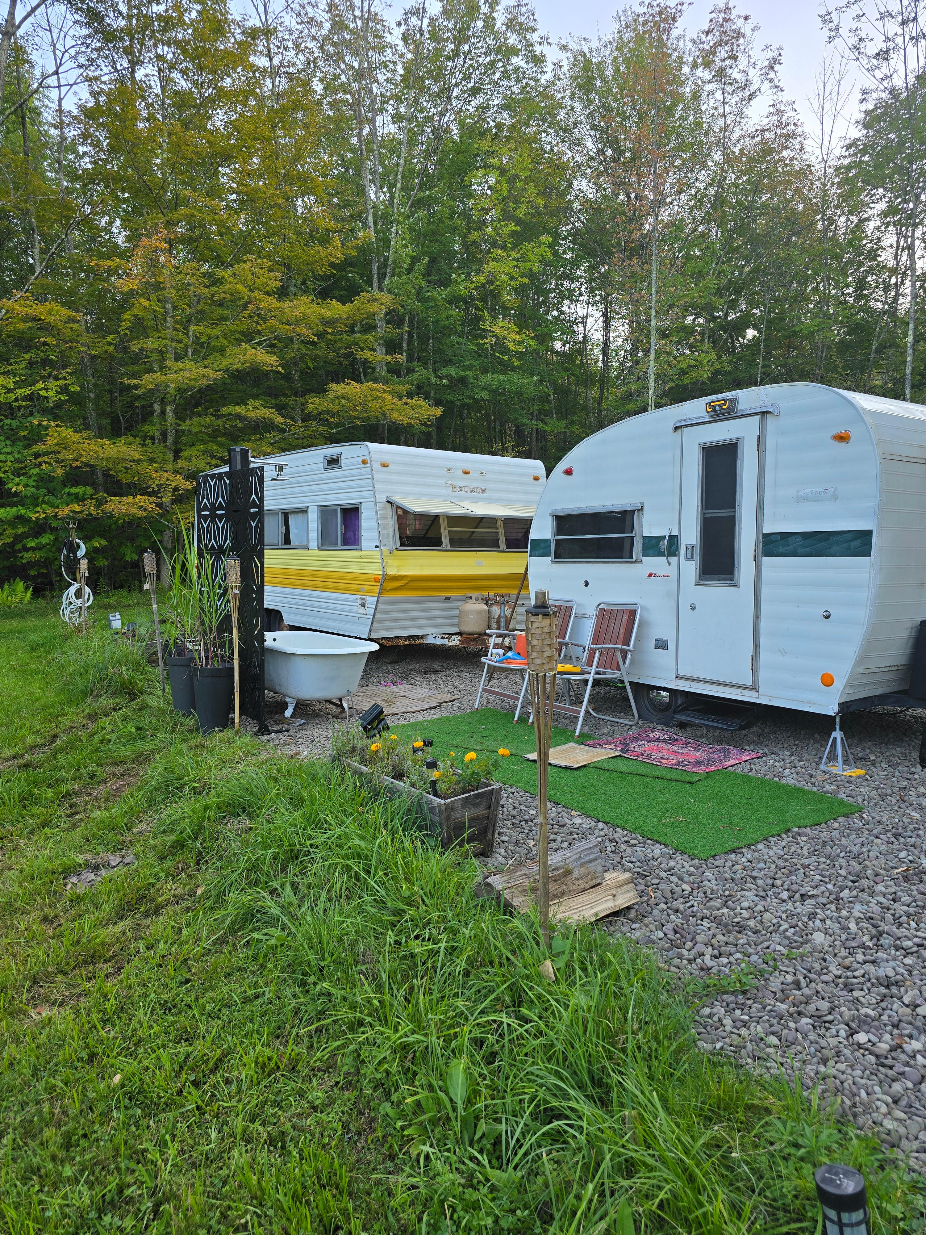 Wood heated claw tub with solar shower.