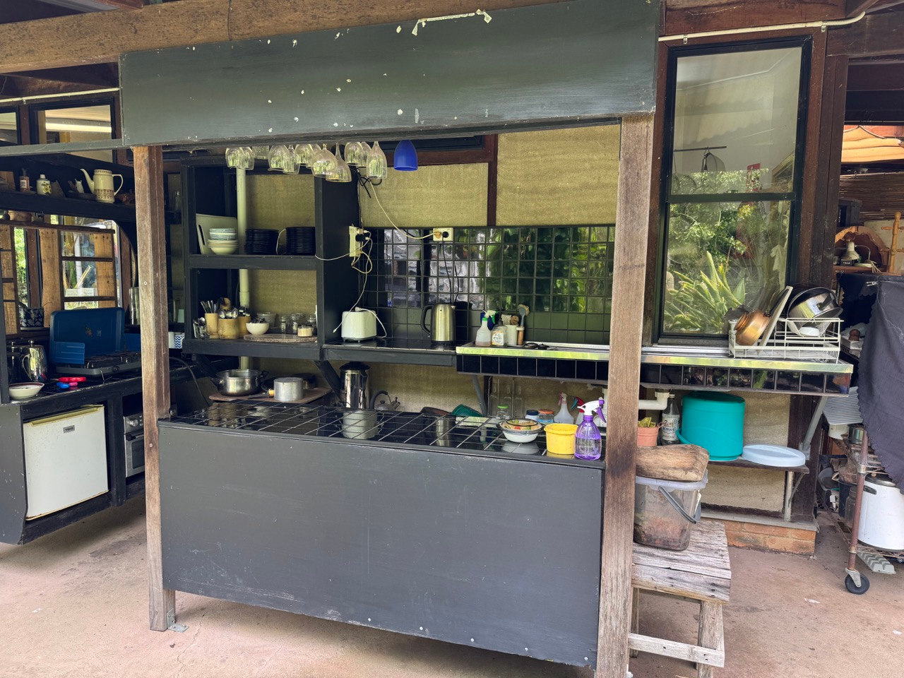 Al fresco communal kitchen at the main building has a gas stove top, toaster, kettle, cookware, cutlery and crockery plus teas available for making a cuppa.