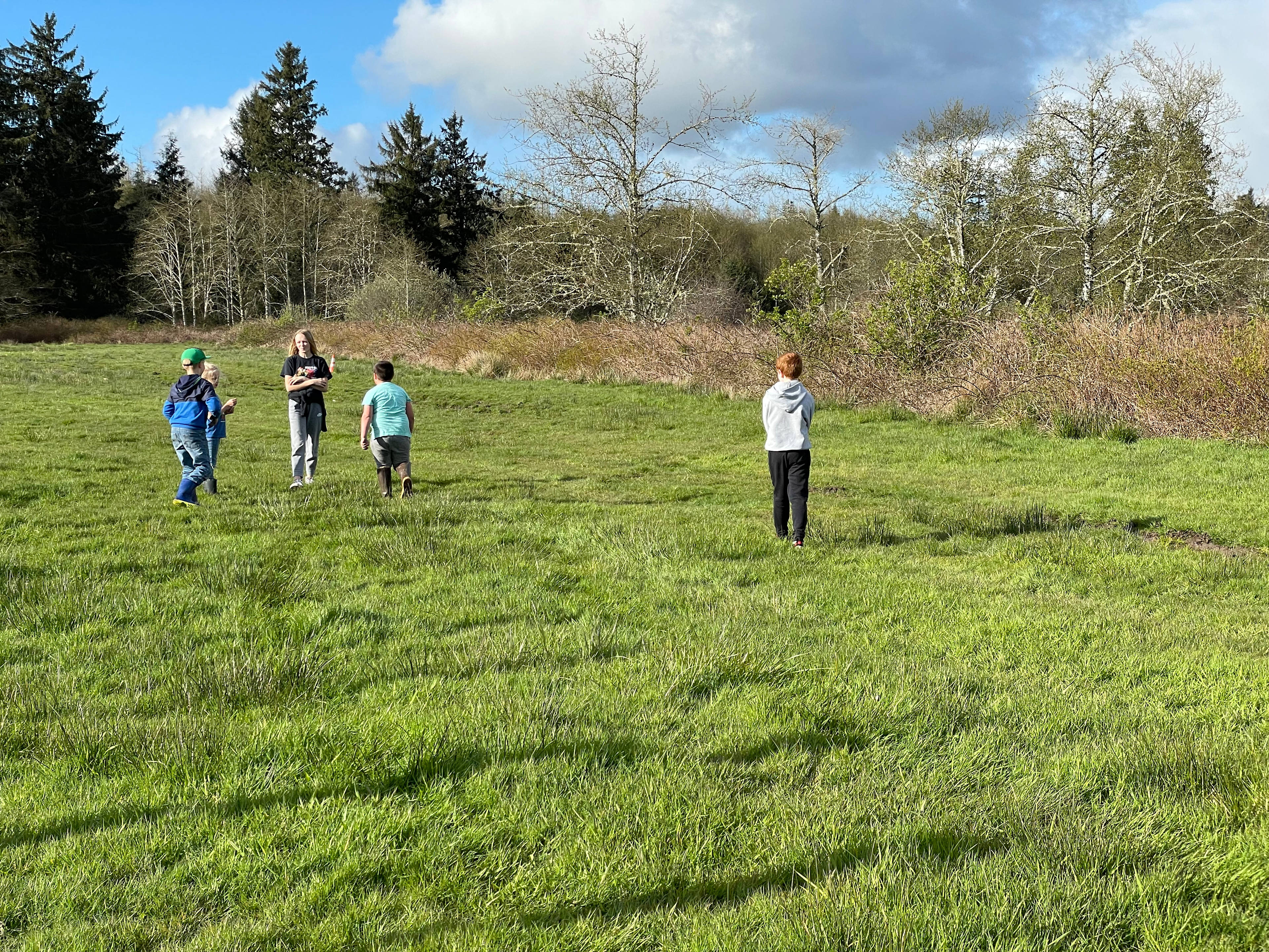 Kids playing tag in the field!