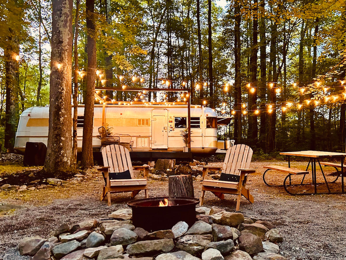 Tilly, our retro camper at Rustic Acres — unique glamping experience with comfort, charm, and scenic forest views.