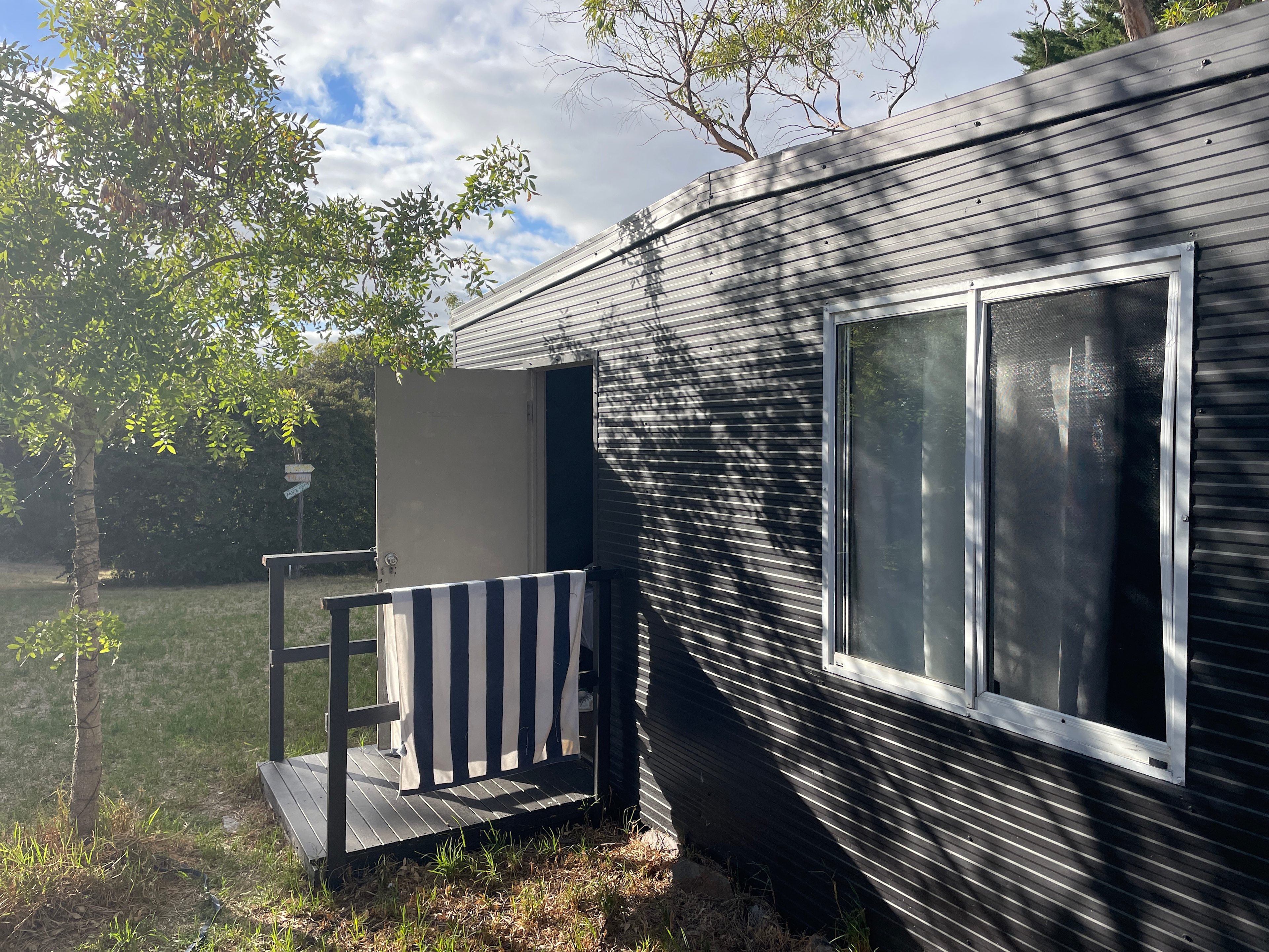 The outdoor of cabin 1…. It’s has a lock on it. Please ask for the code. 

Cabin 1. King bed. 2 people. Linen, towels provided. 