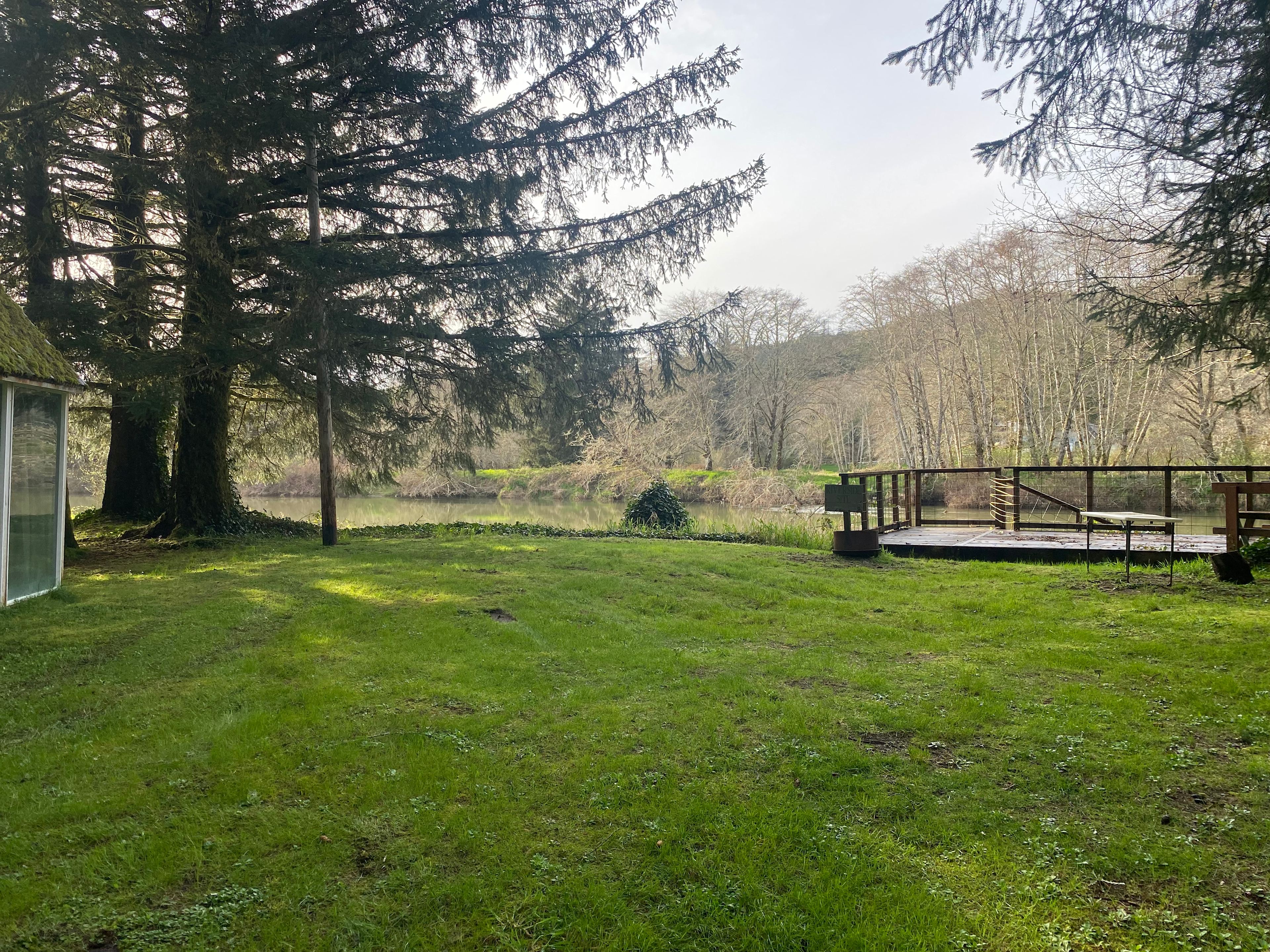View of the campsite looking toward the River. You have your own deck looking over the river. There is no access to the water from this deck. 