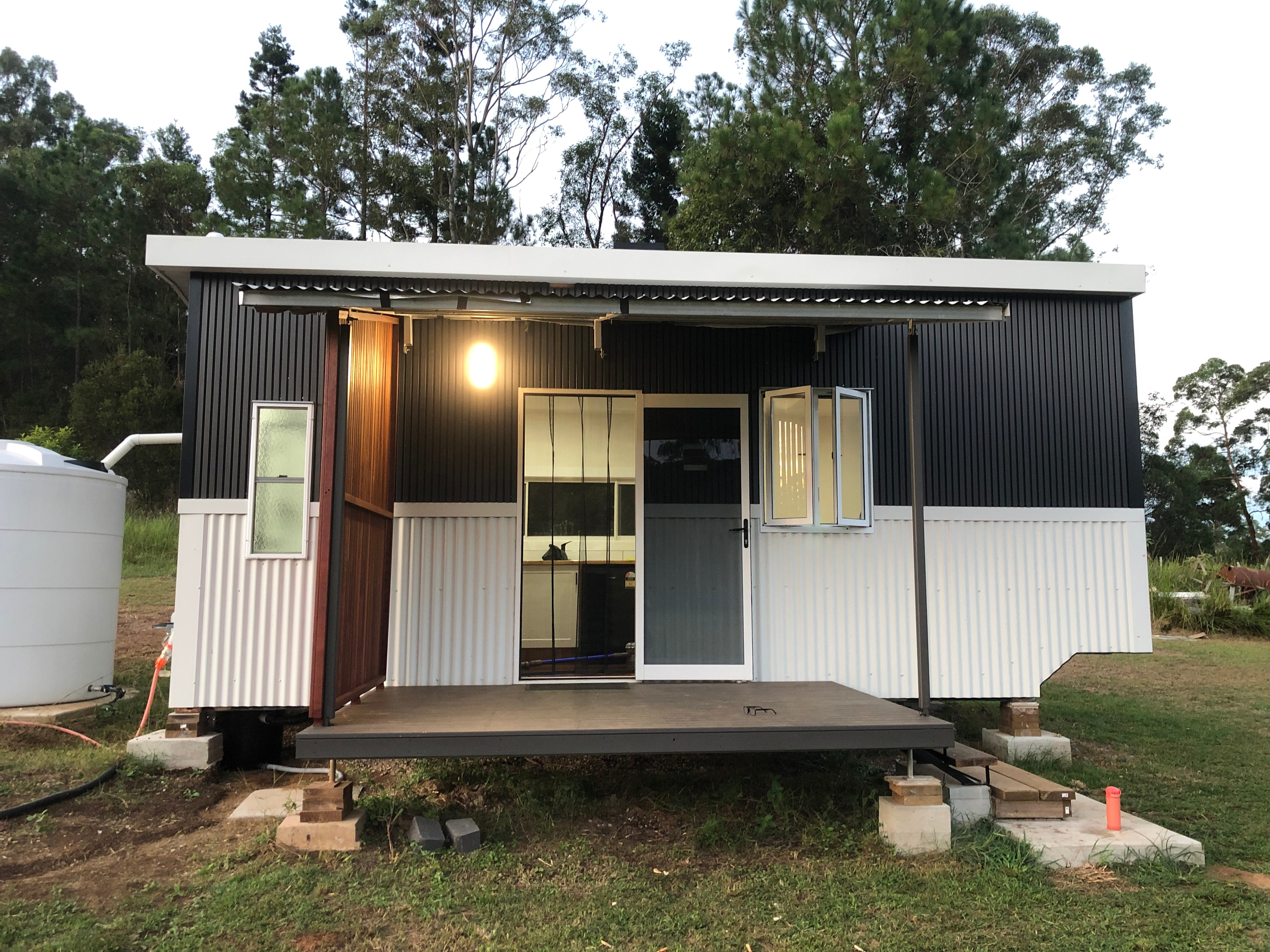 Patio verandah with two person chair and table.