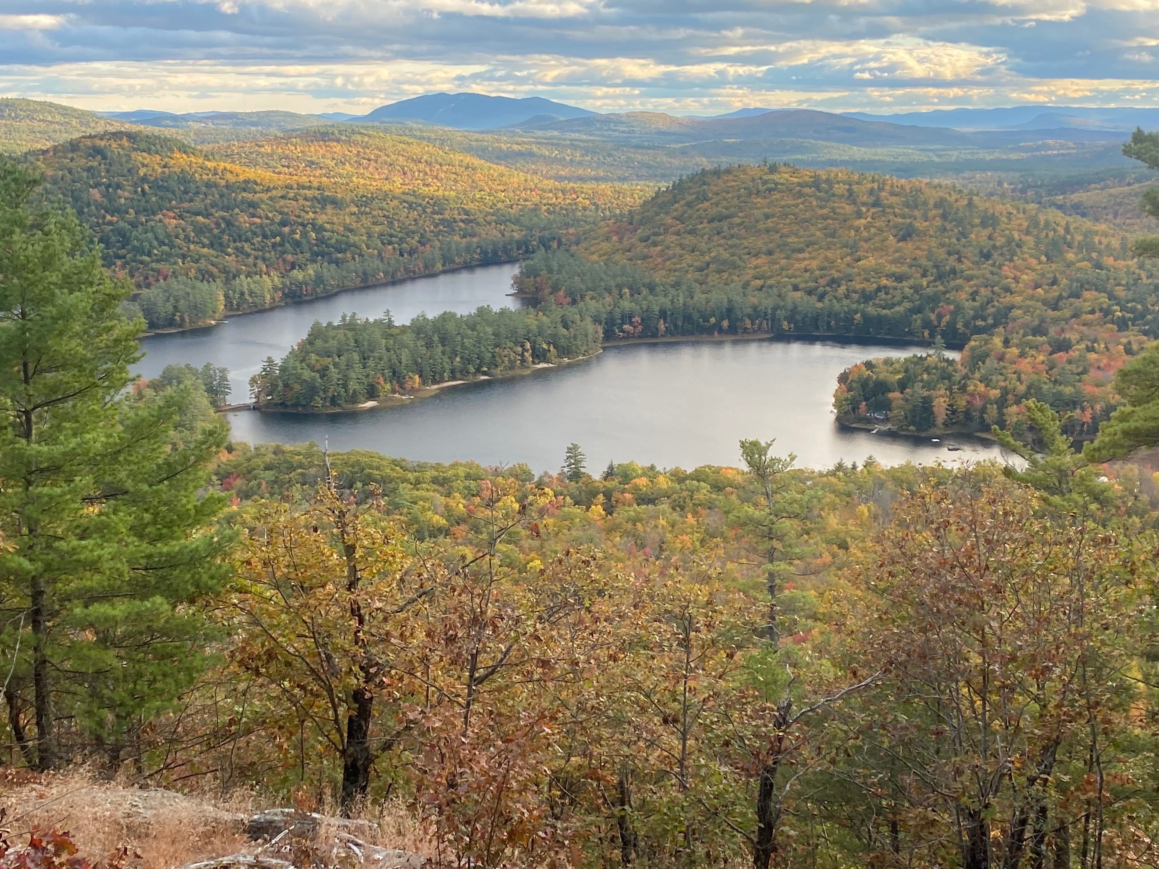 15 minute hiking trail takes you to a mountain cliff lookout view of 5 kezars lakes and a panoramic of mountains including Mt Washington.