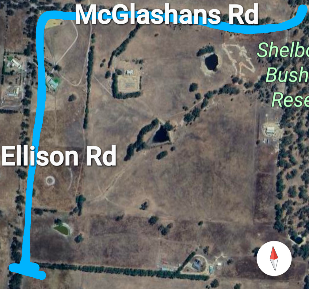 Arial view showing main road (dirt) into property 