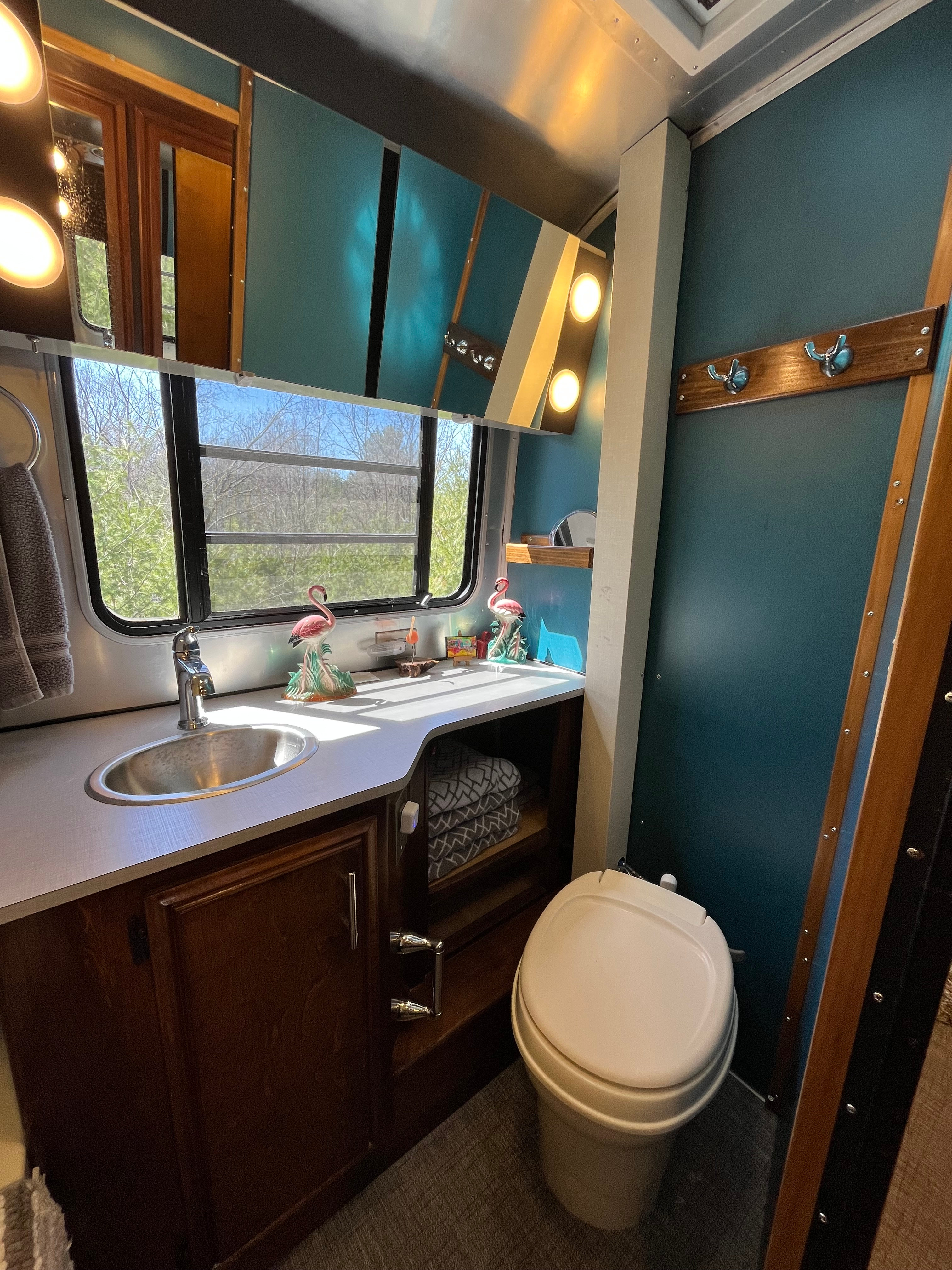 Bathroom sink, medicine chest, and stool.