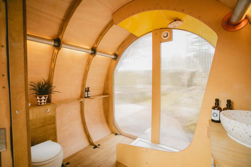 A full bathroom with flushing toilet, hot and cold running water and shower is provided in the Fuselage Link just across the deck from the main cabin. 