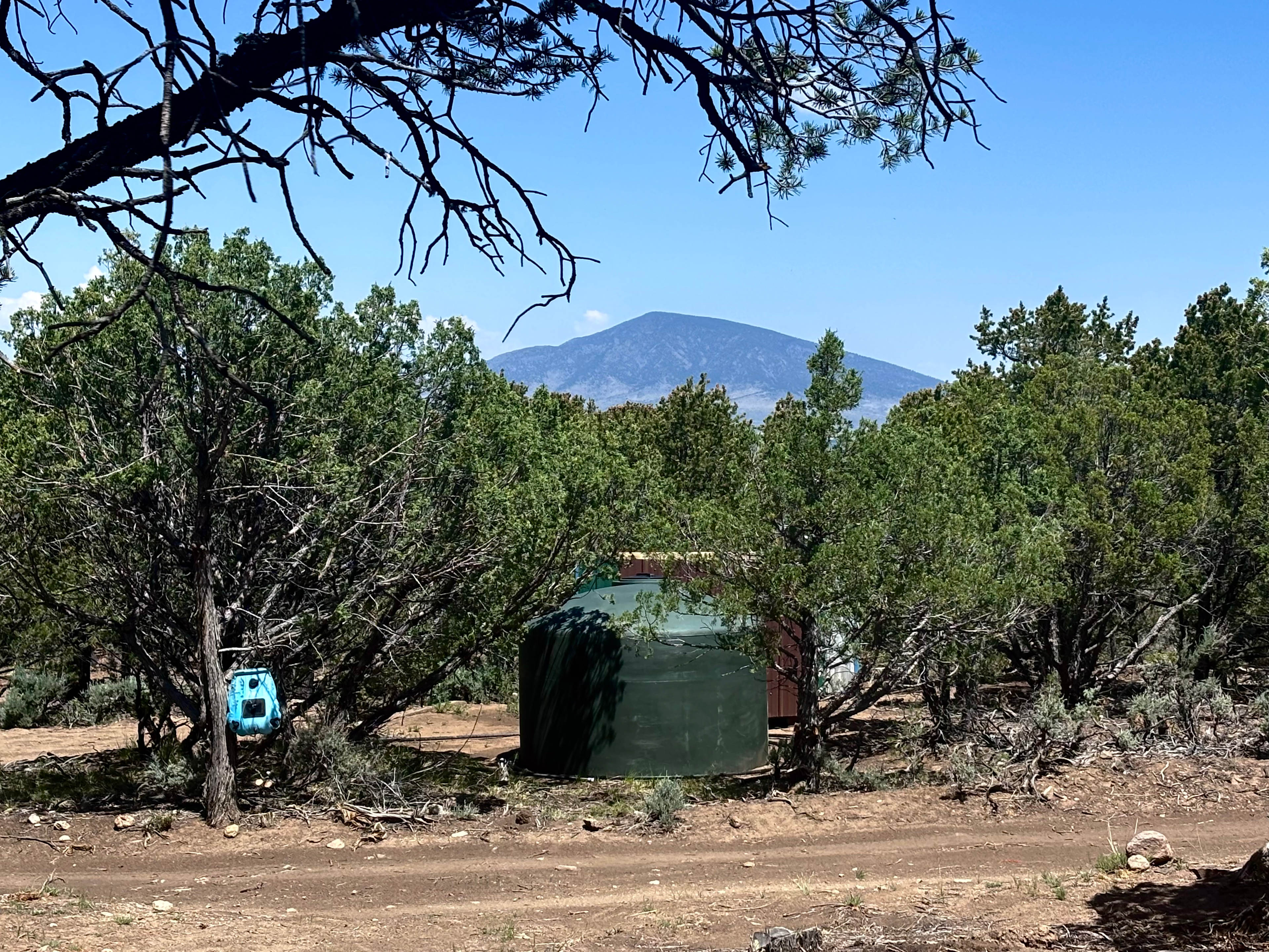 Our shower and outhouse area.  The water from the little river and the cisterns, and the spigot are not potable, and should be boiled before drinking.