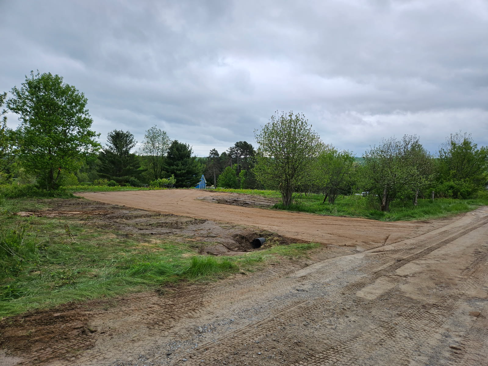 From the road the site driveway and parking 