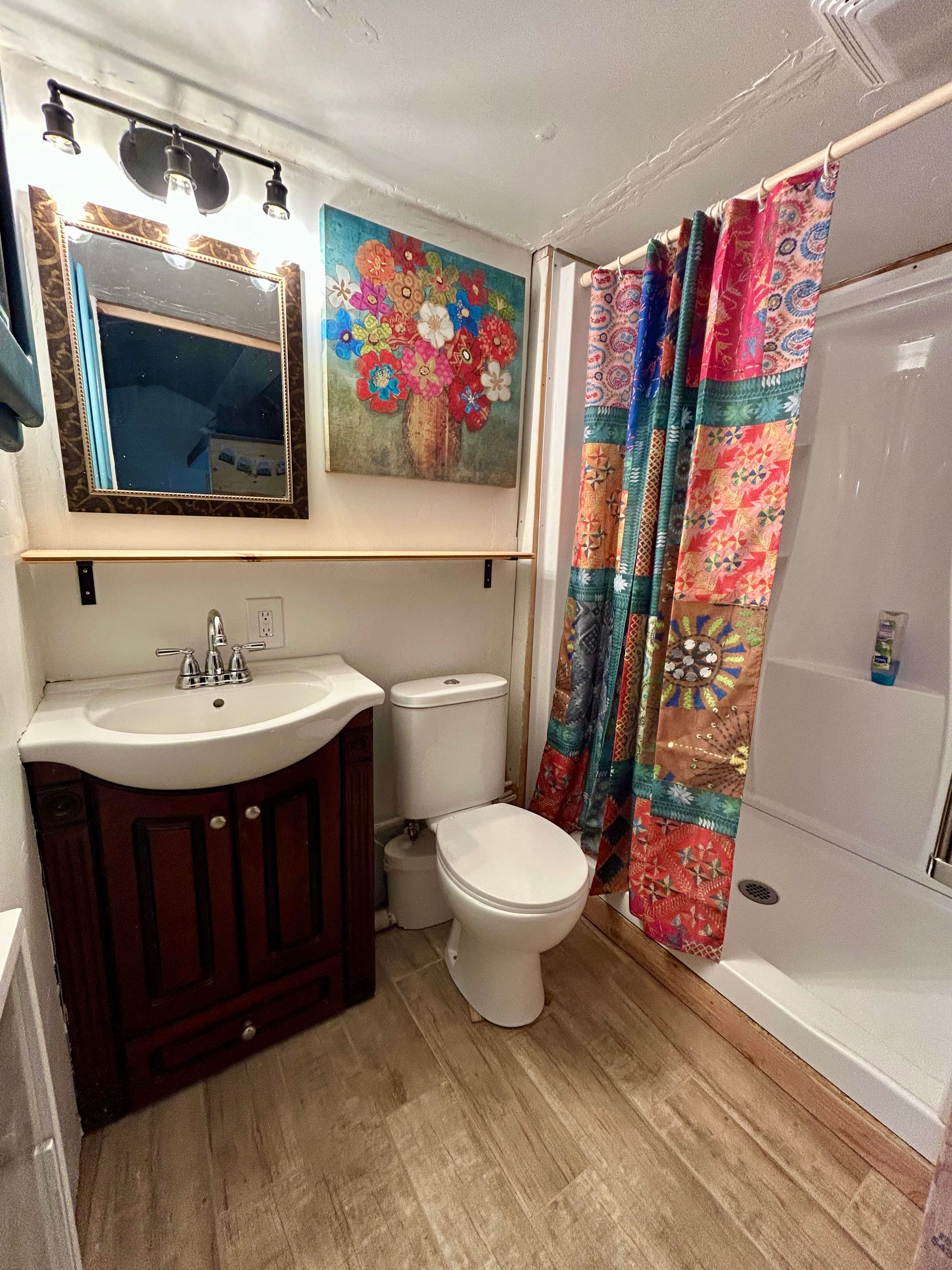 Full bathroom with propane heated walk in shower.