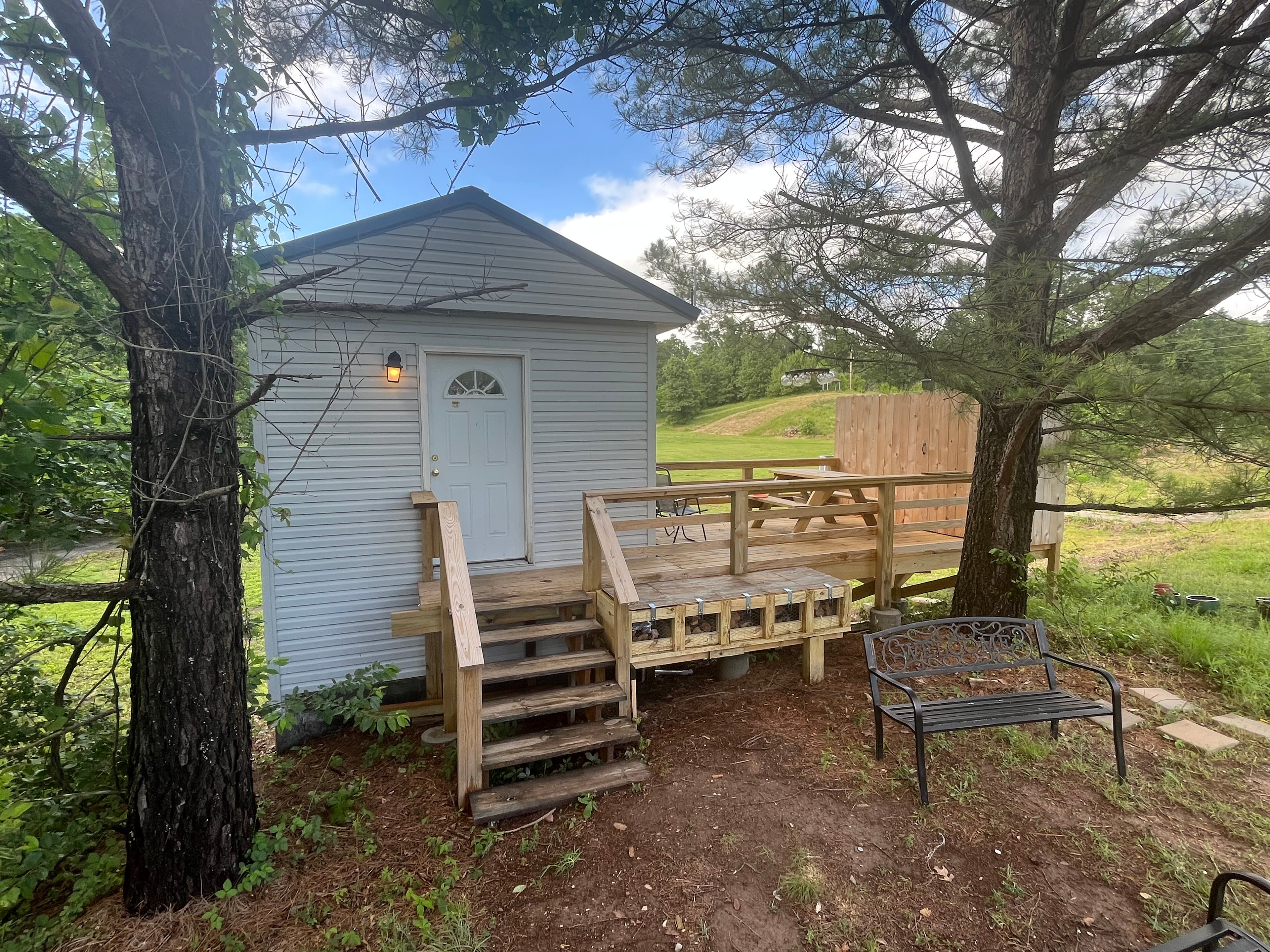 The lounge has a vending machine and a deck with a picnic table, also an outdoor shower is located at the back of the deck.