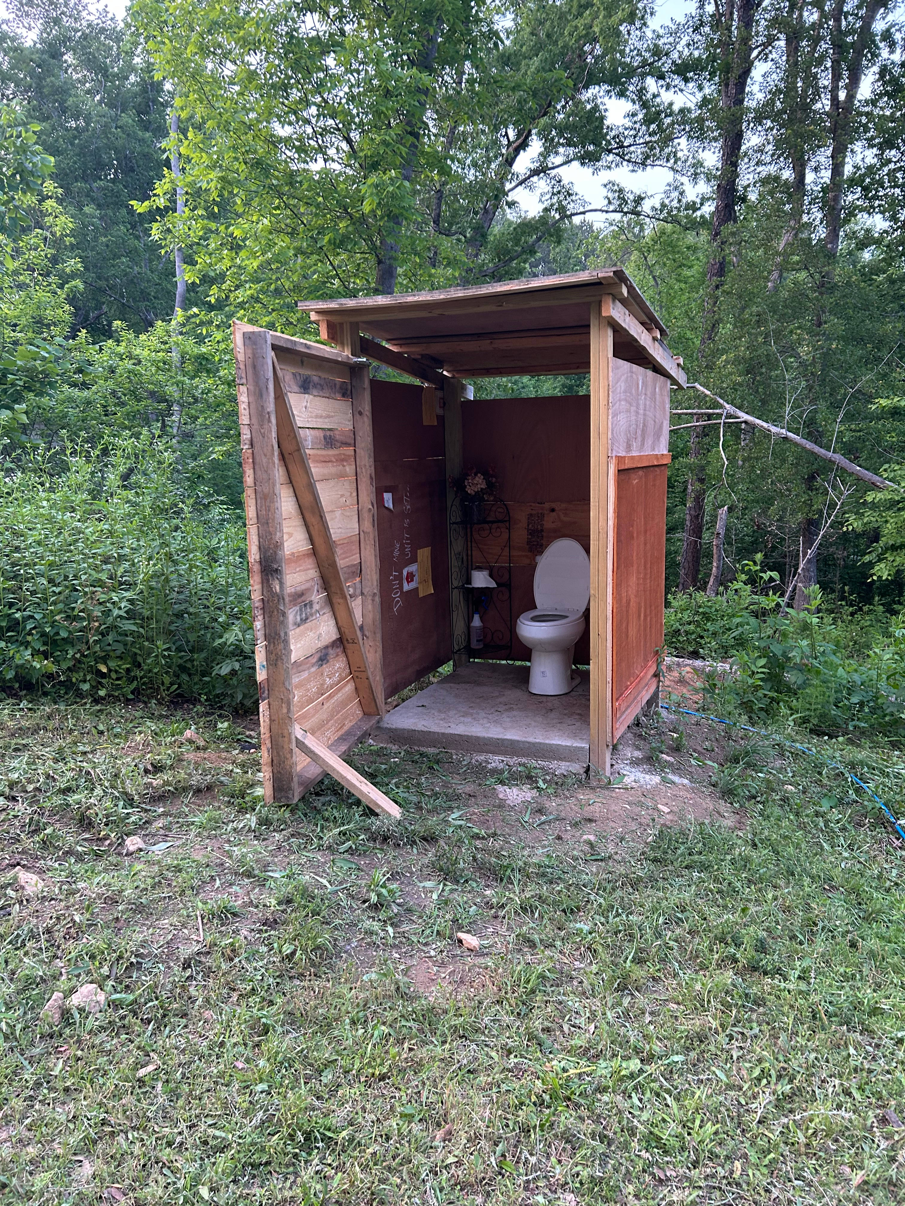 Bathroom with flush toilet. Also at the moment there’s a bird nest in there with little baby bir