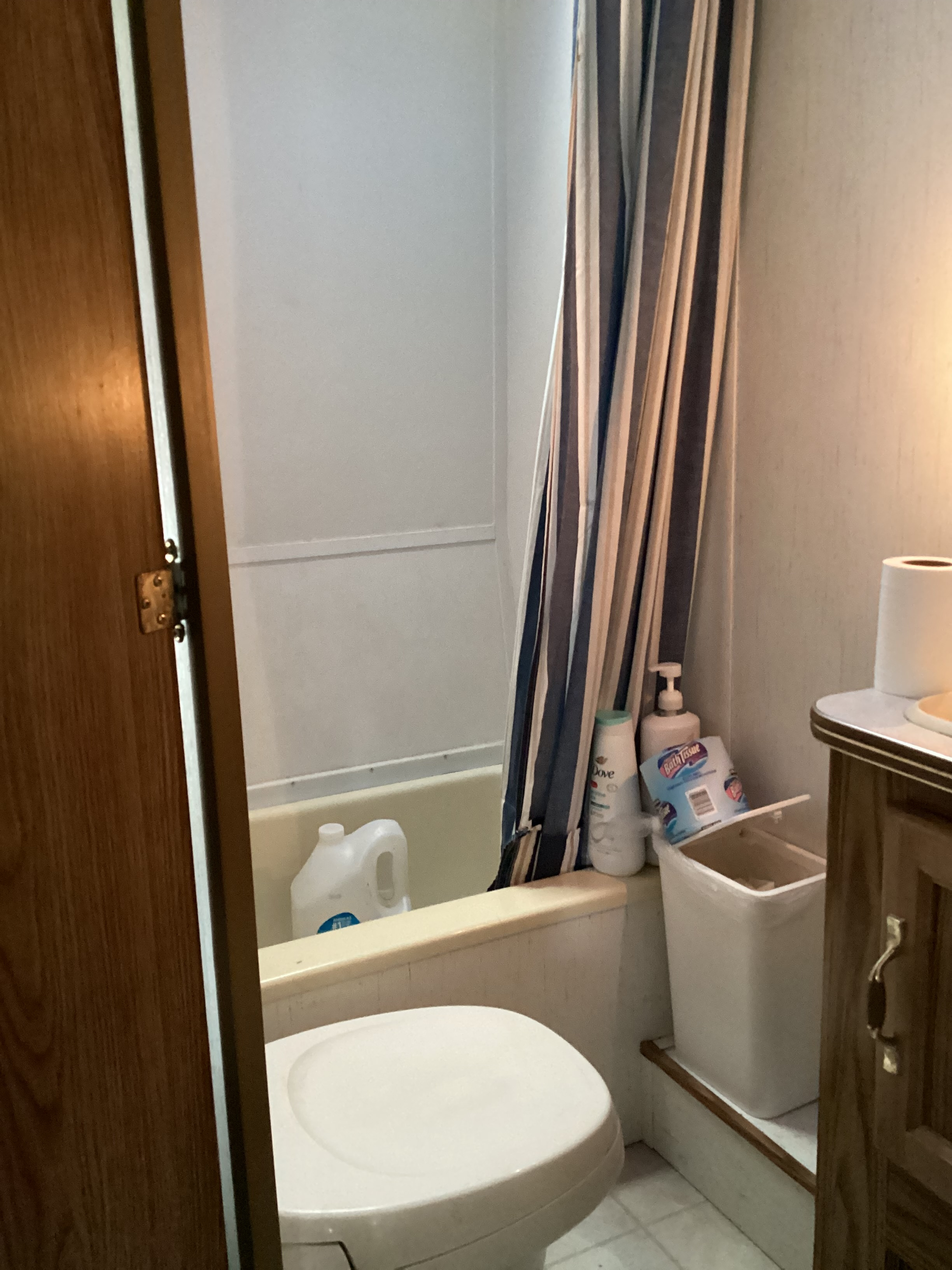 Toilet is best flushed by hand with container of water. Shower works only with little battery pump in a five gallon bucket of water you’ll set on toilet. Please dispose of used toilet paper in white trash can. I have an old septic the waste will have to be transported to.