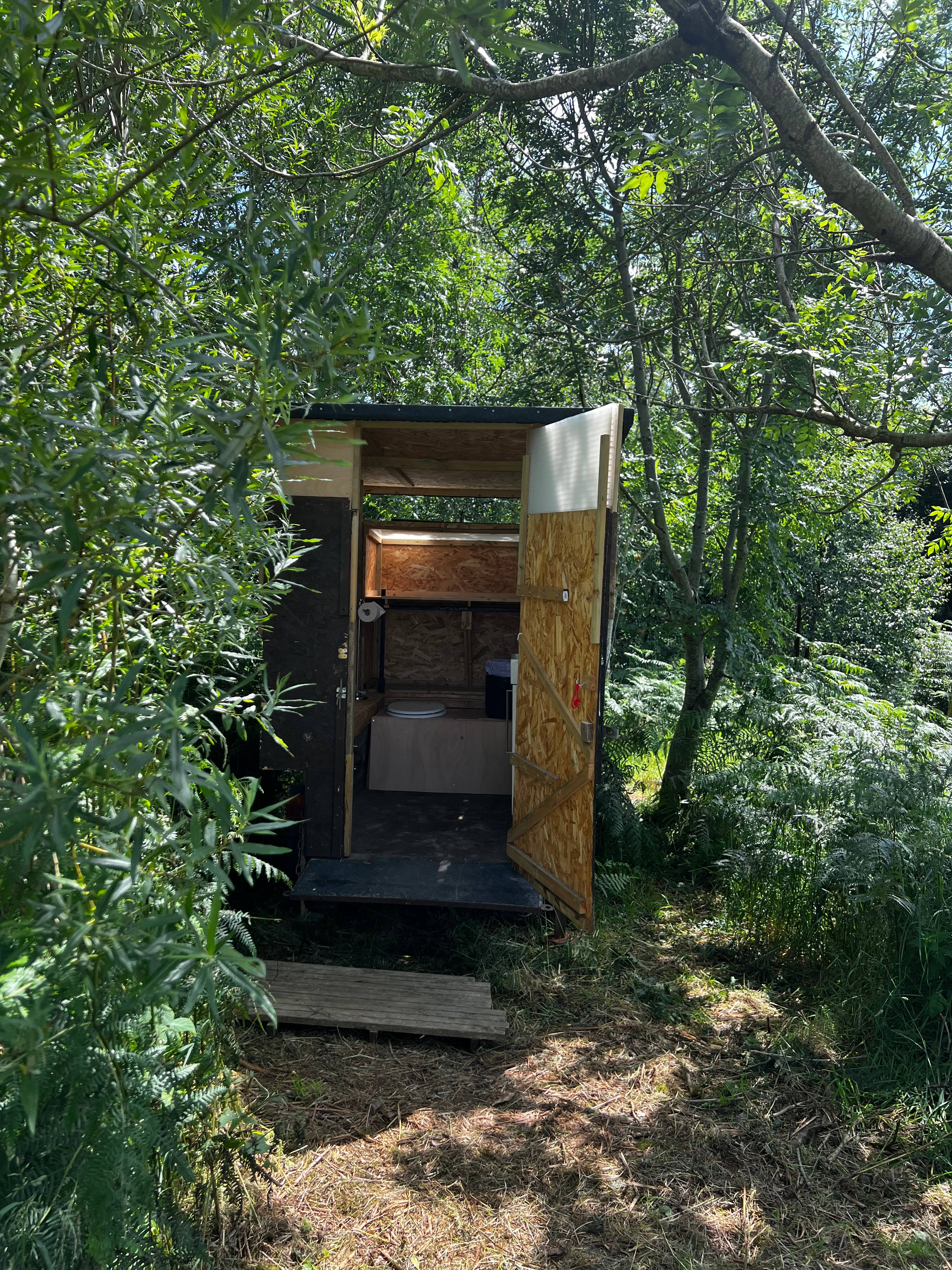 The compost loo, amongst the trees