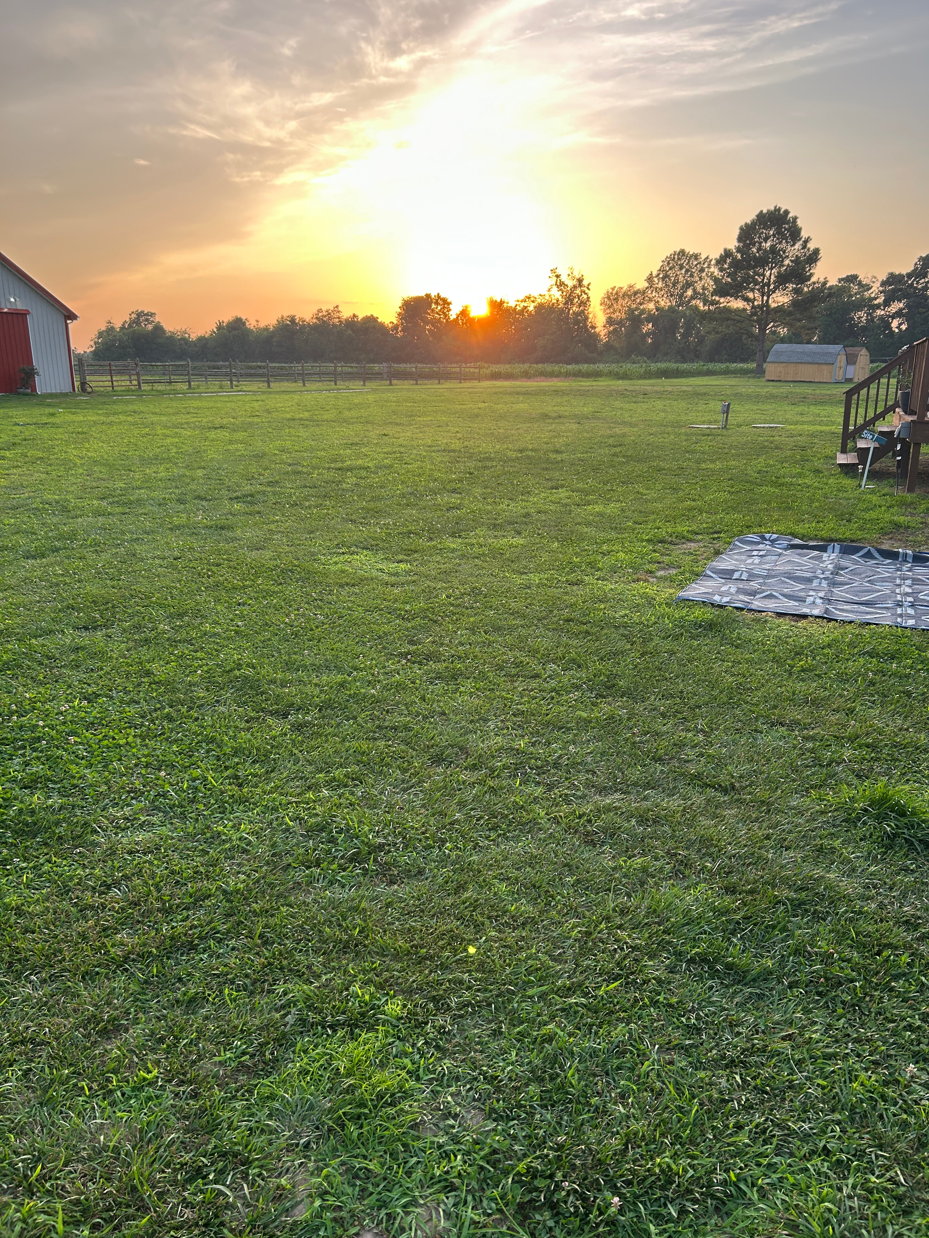 This is where you will park. Next to my camper and the 30 amp is on the deck and spigot is near there as well. 