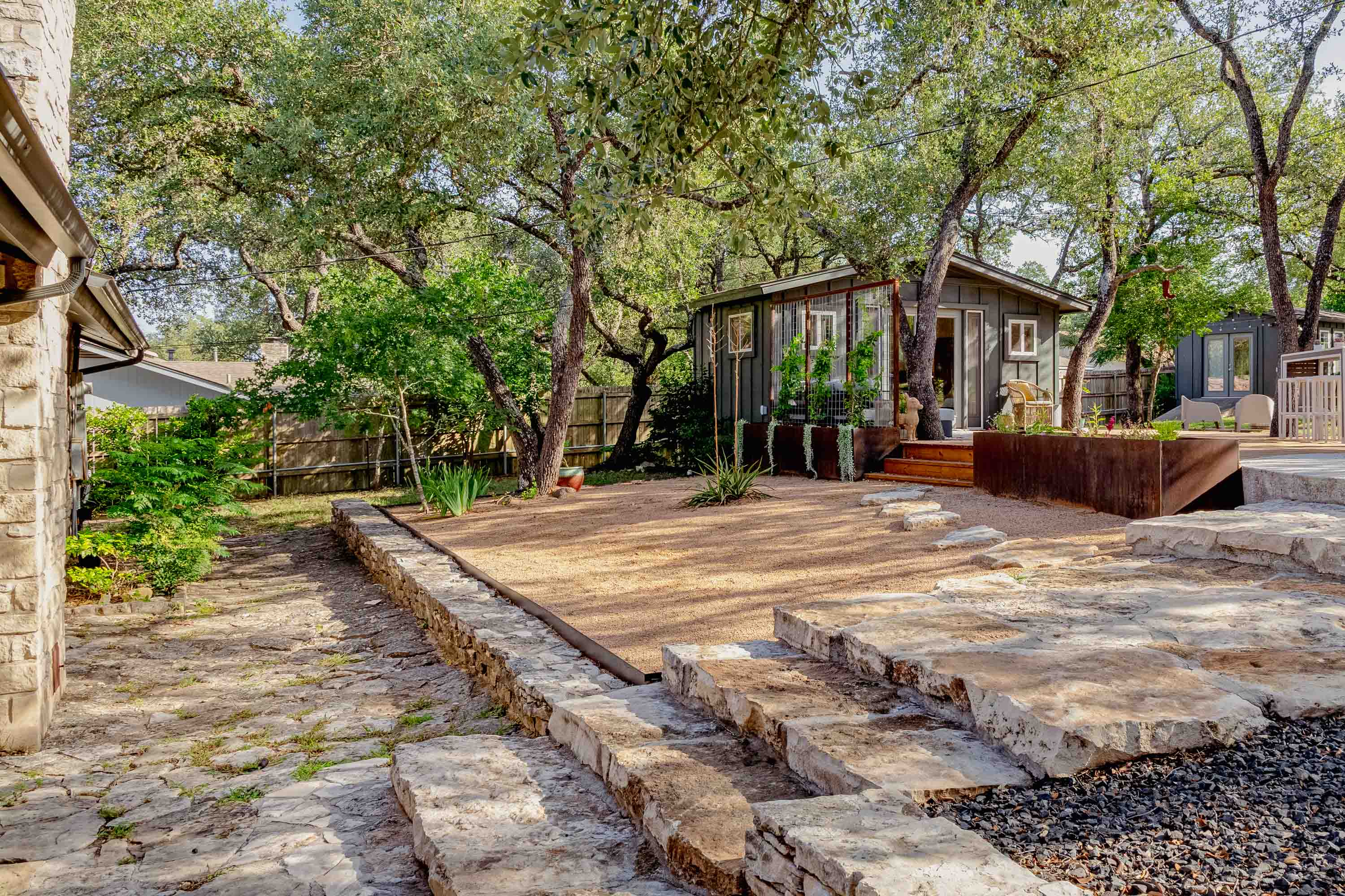 The guest house sits comfortably close to the homeowner’s house, offering convenience and a friendly, nearby presence without compromising privacy.