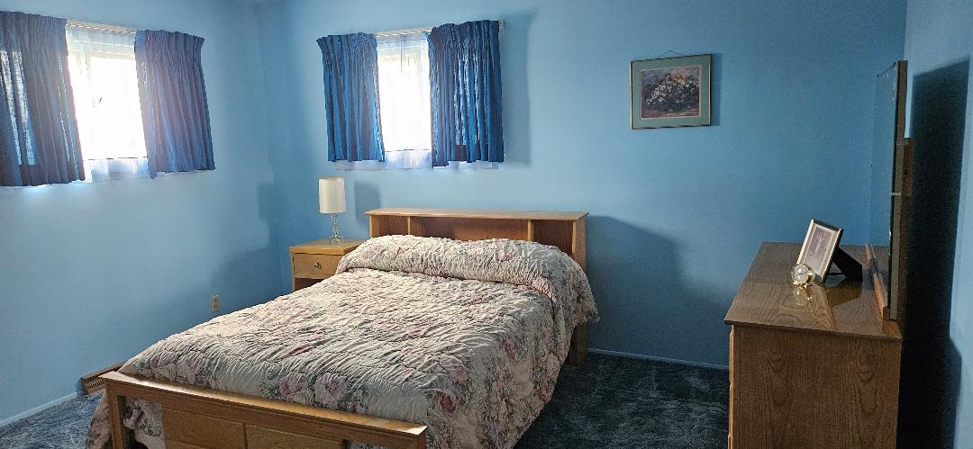 Blue bedroom: full size bed. 