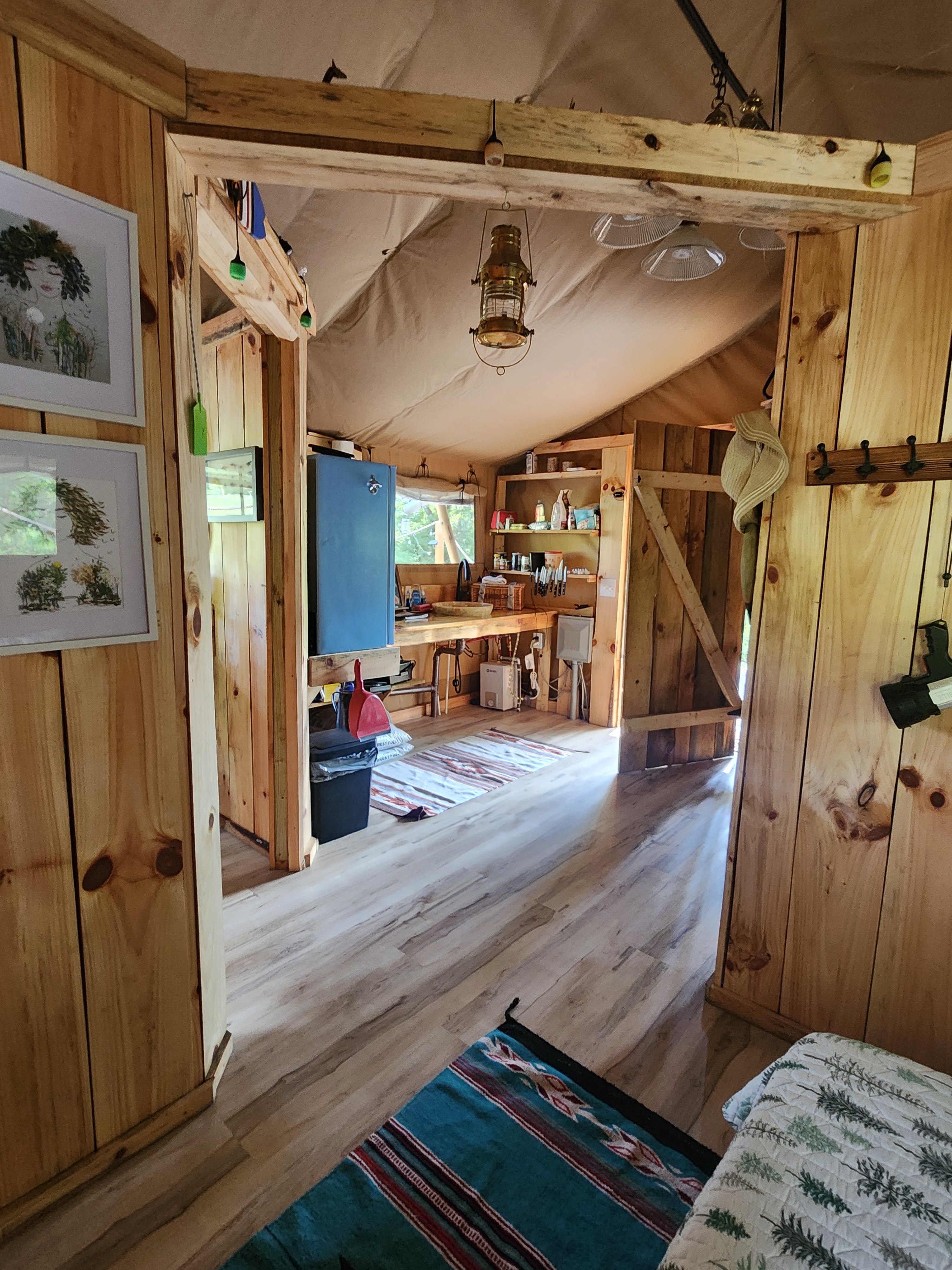 View from bed- kitchen ahead, bathroom ahead to left, living space to right, separated by wall