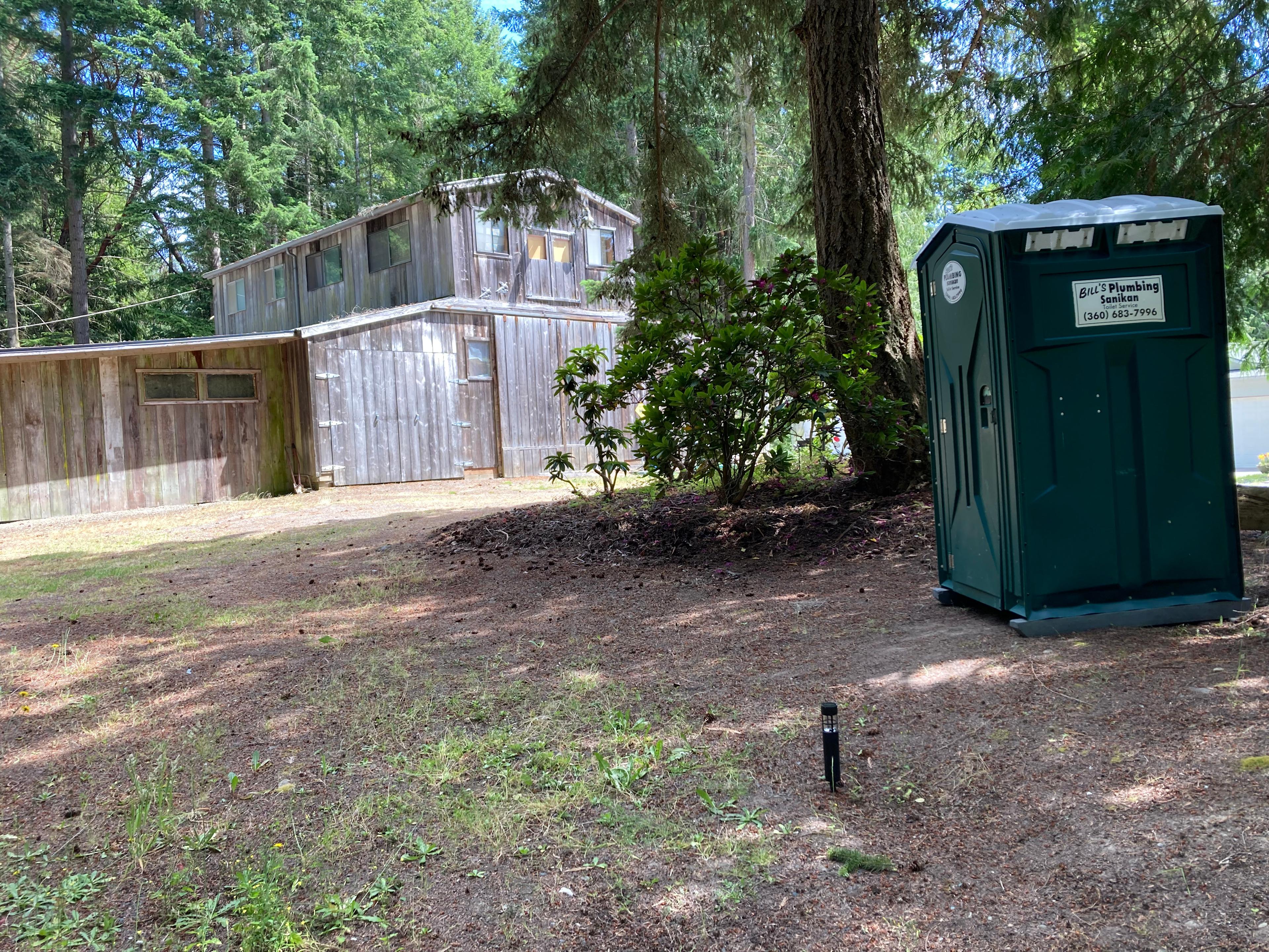 Sanican near Parking (cleaned and emptied weekly)