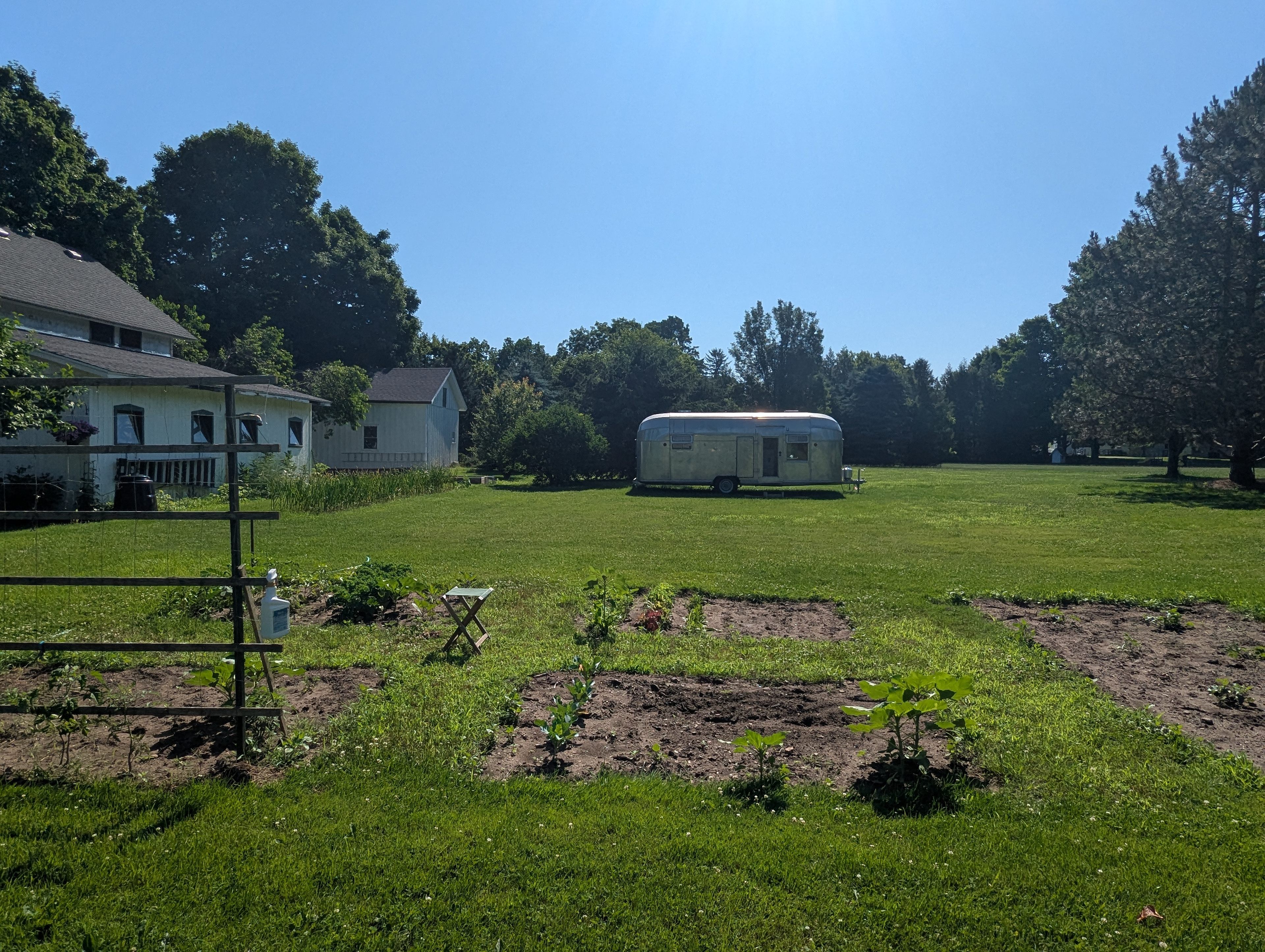 View from the garden. Our yard is mostly private. We have great neighbors who you may occasionally see working in their yards. 