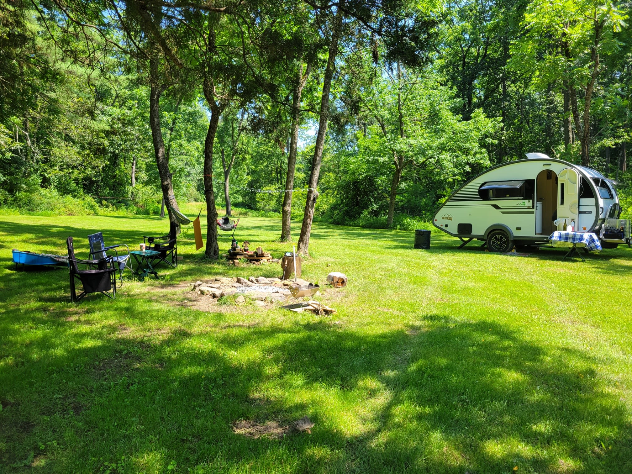 Sunny day with lots of patched of shade from the trees.