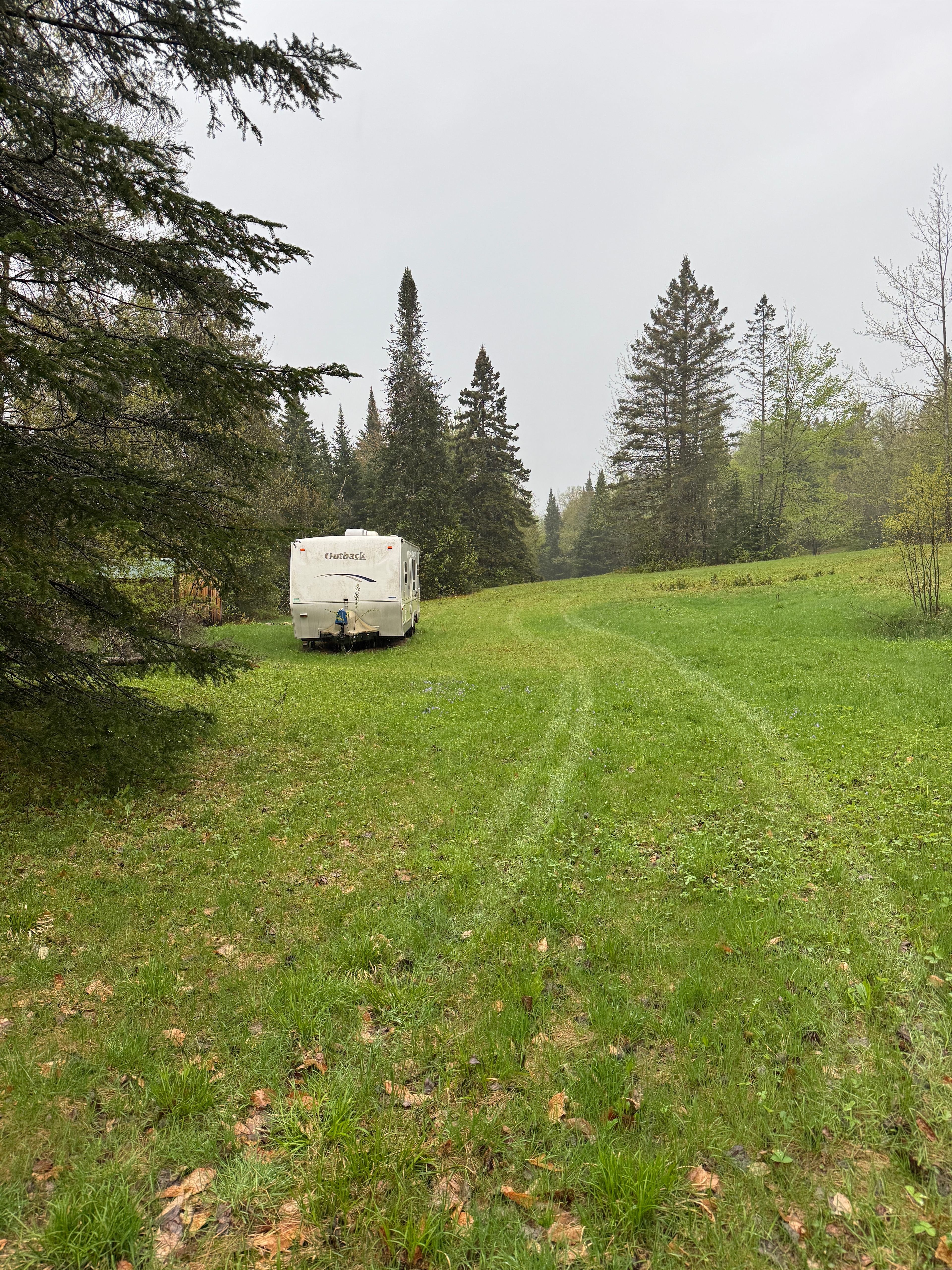 Camper in the woods near swimming