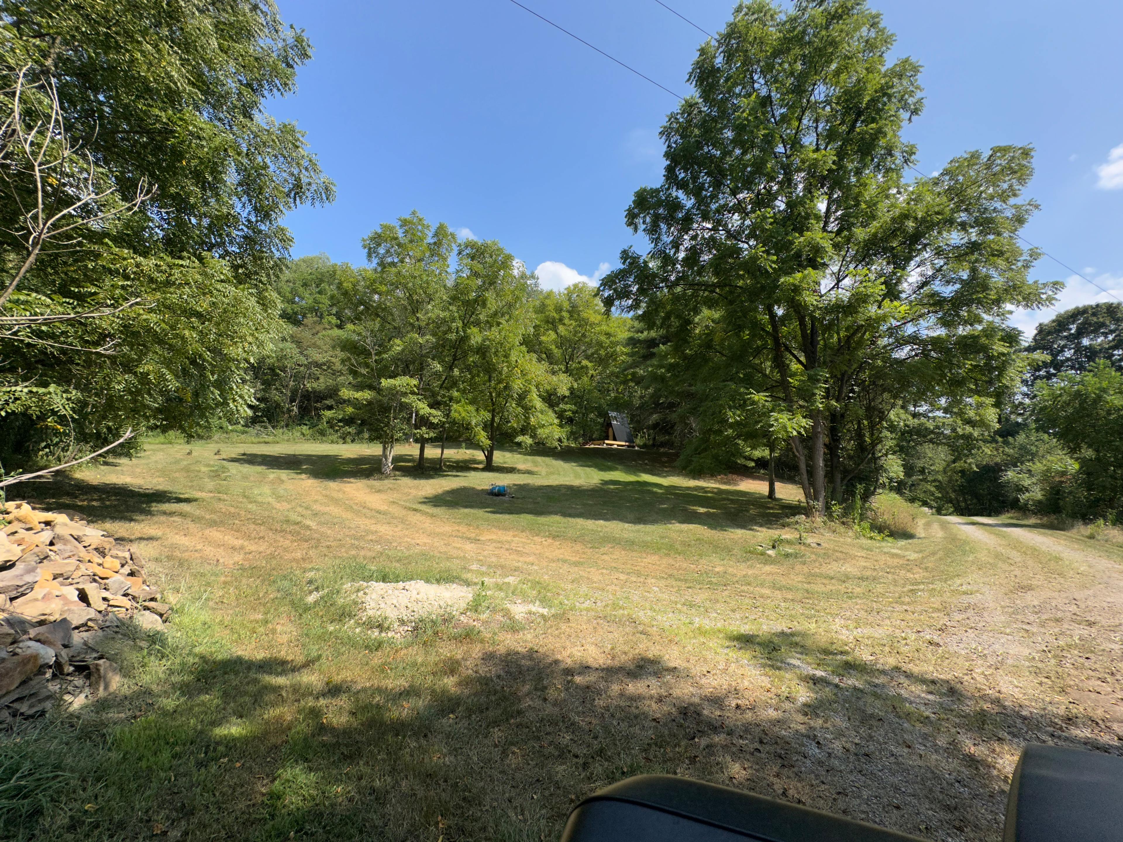 Entrance of property off of dead end gravel road. View from gate