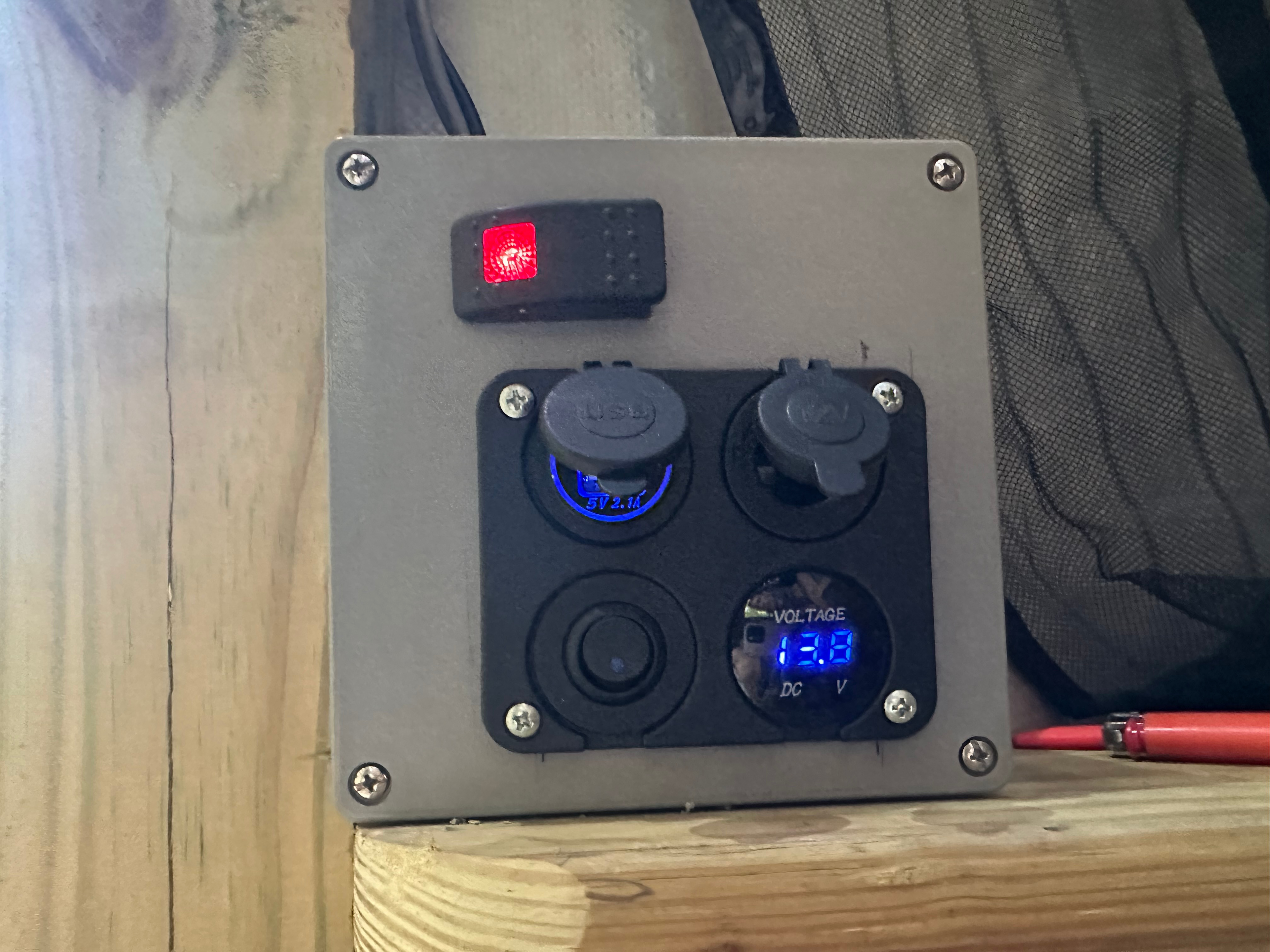 Switch for small cabin light.

Two usb ports and one 12volt socket for phone charging, fan and bug zapper charging