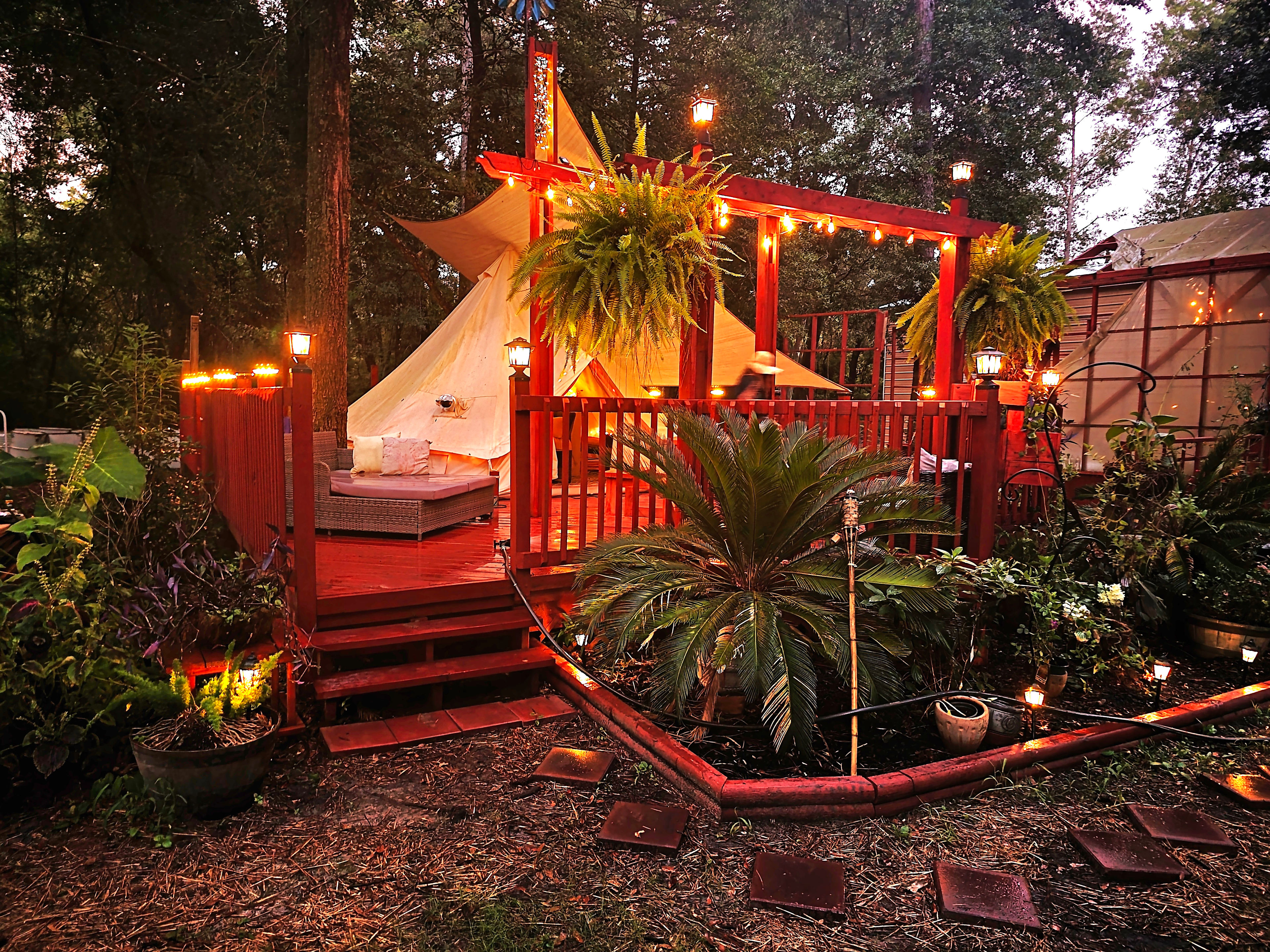 The 20x28 wood deck platform is bursting with solar powered lights that come on at dusk, making the campsite look magical.