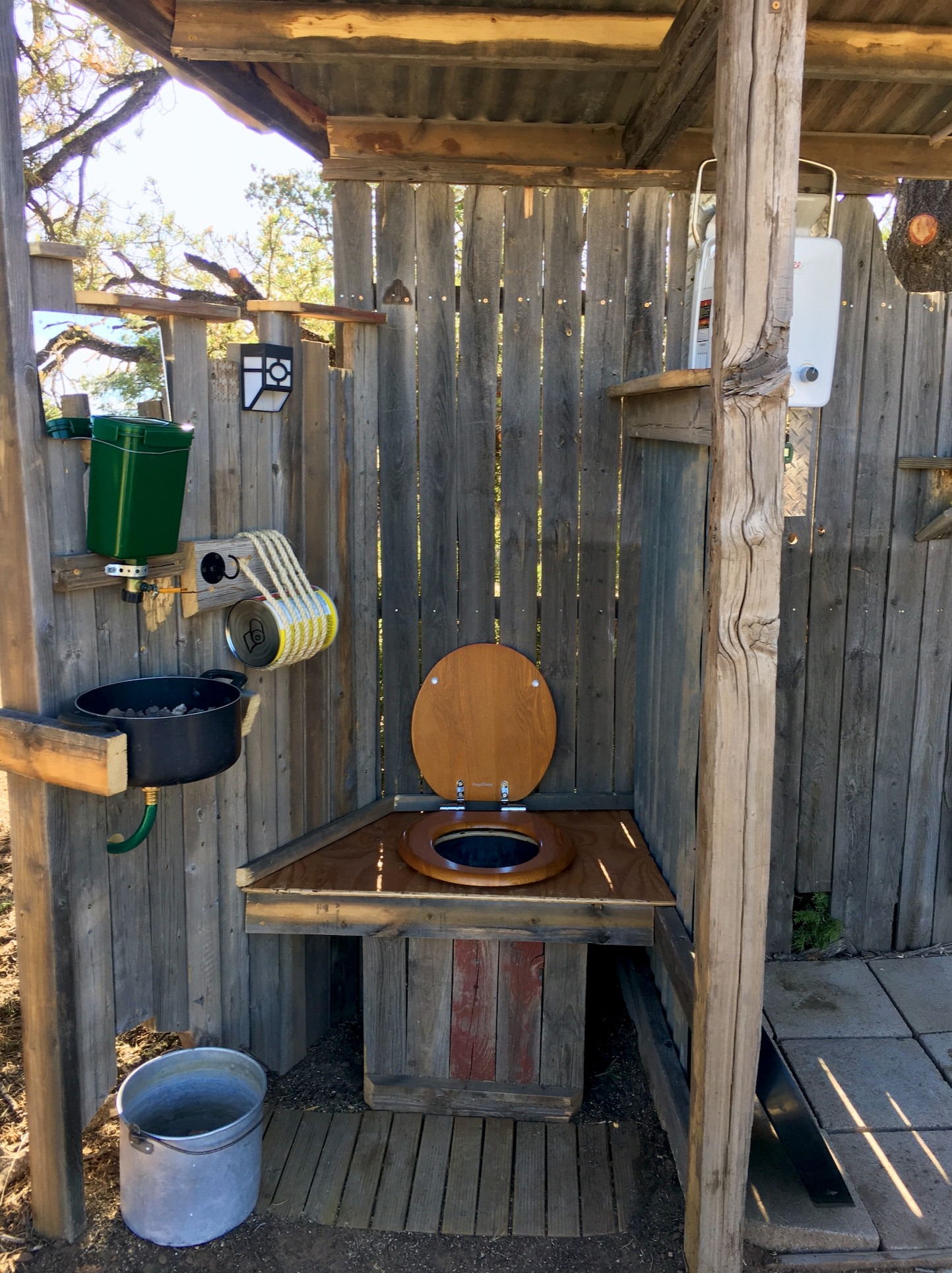 Outdoor compost toilet and sink area.  We also have an additional toilet and sink in our converted Bus cabin.