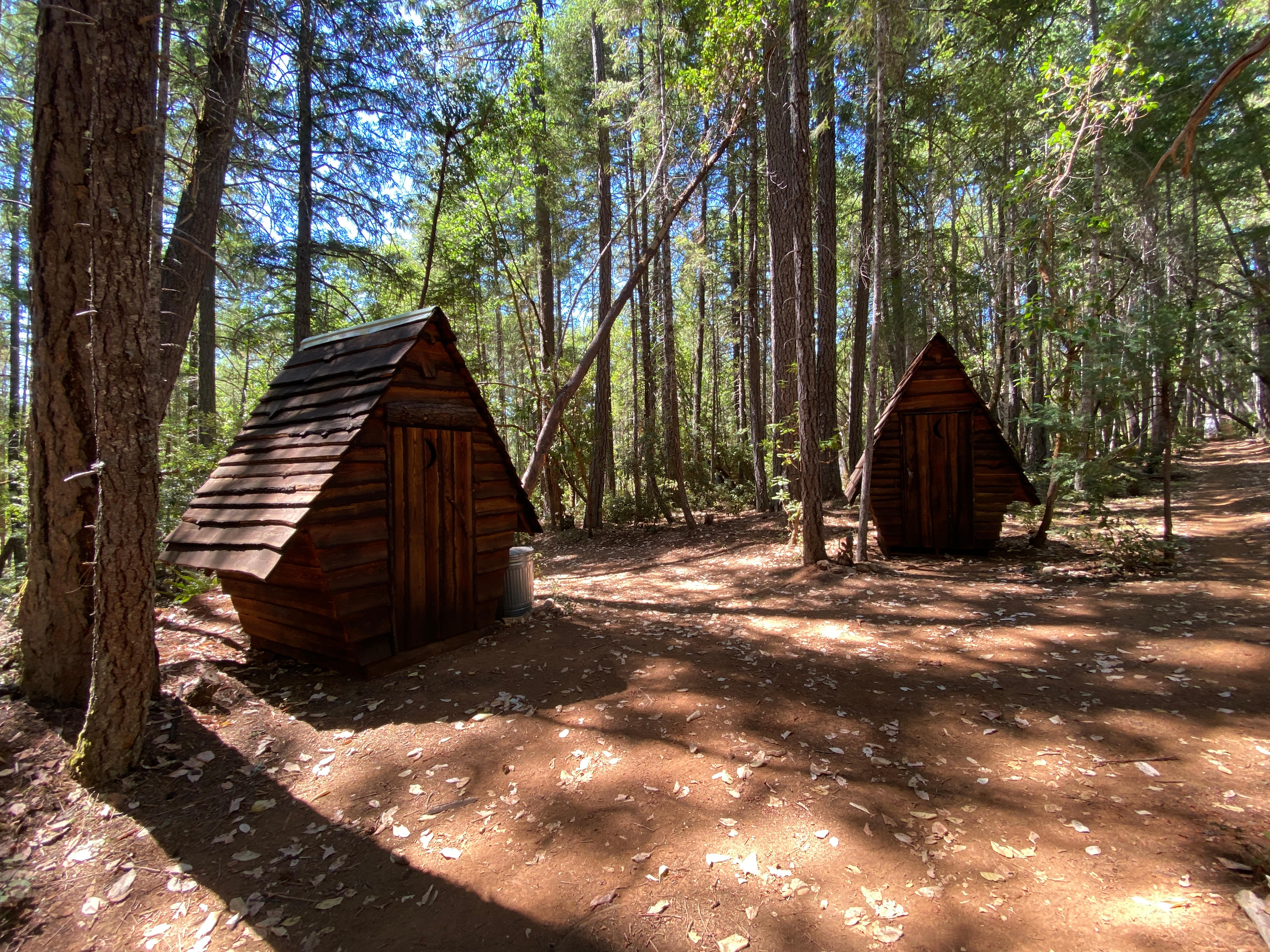 Our two precious outhouses! Handmade and milled on our land!