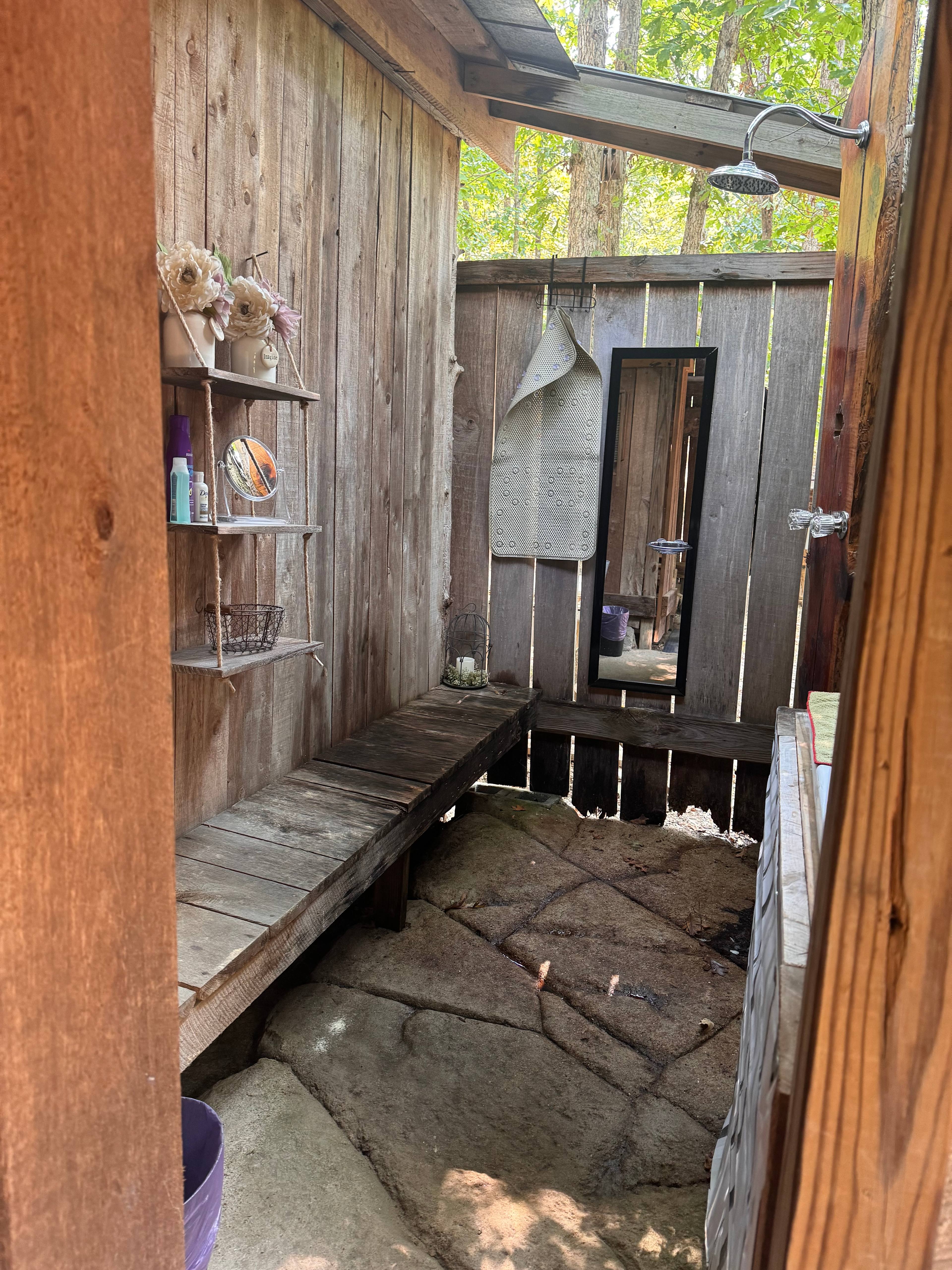 Outdoor shower equipped with hot water on demand 