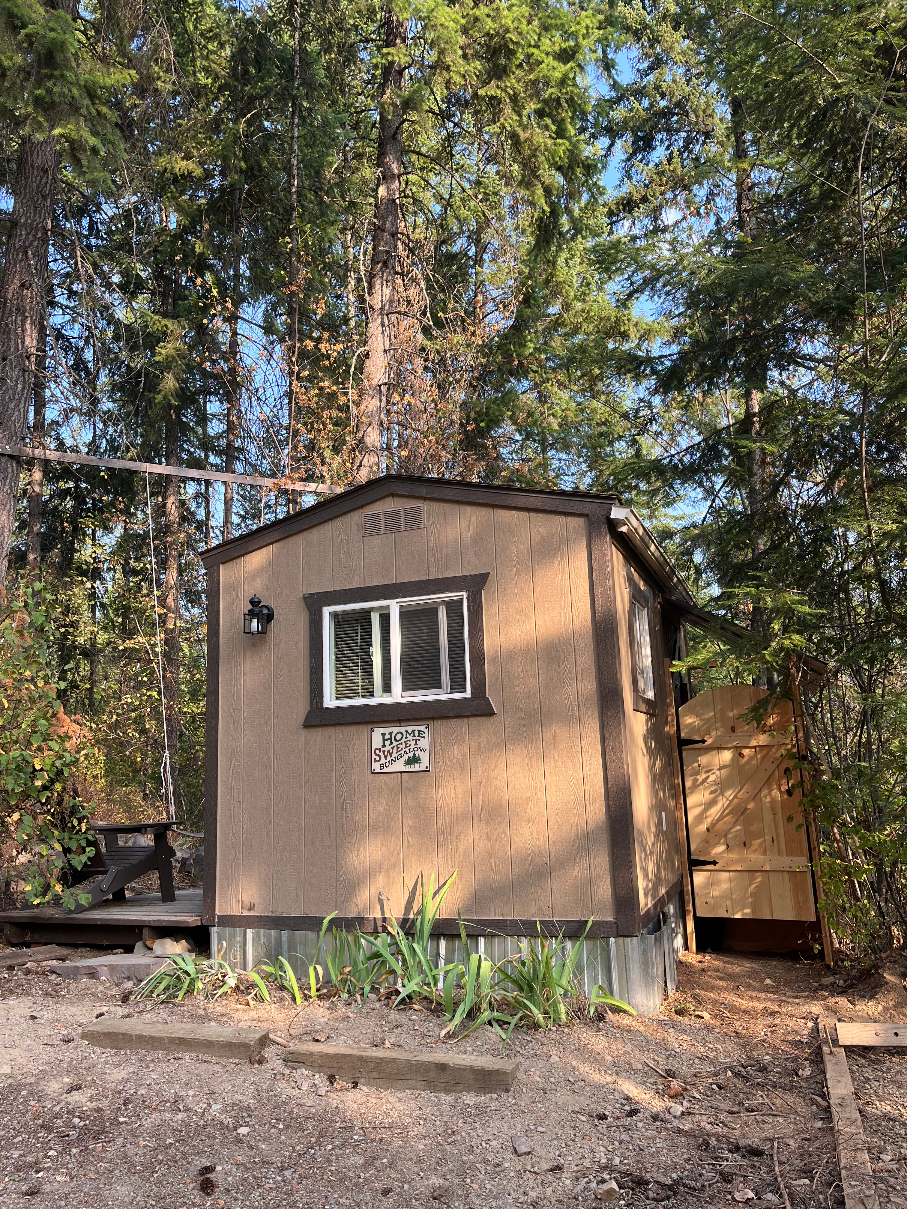 Welcome! The parking area allows for one substantial vehicle. The tent platform is to the right, and the outhouse beyond.