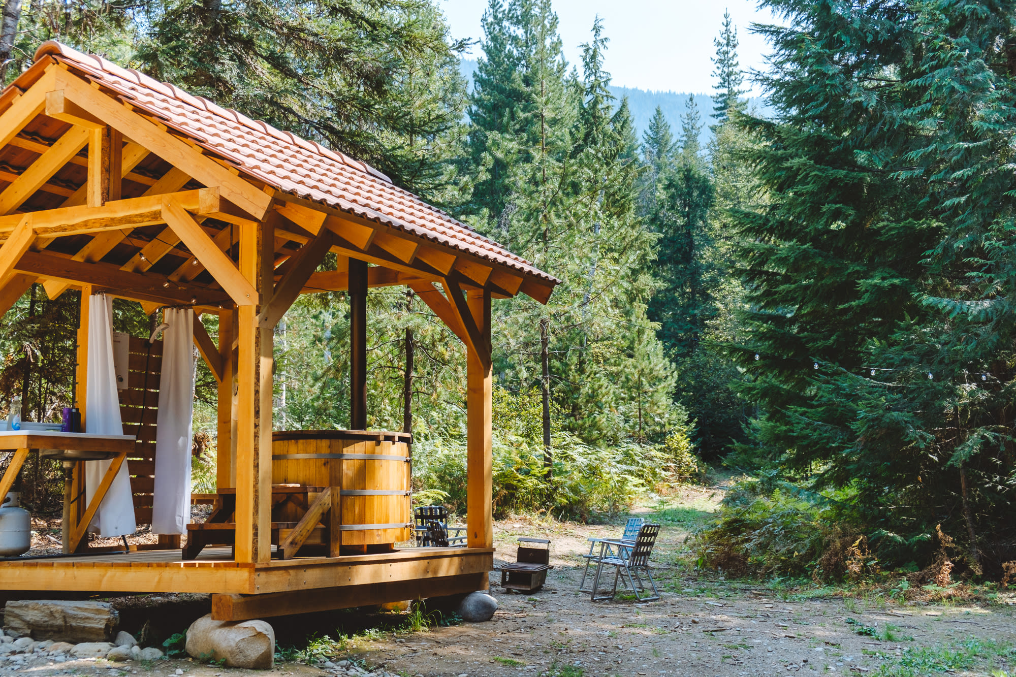 Soak in the tub or enjoy an outdoor shower surrounded by trees!