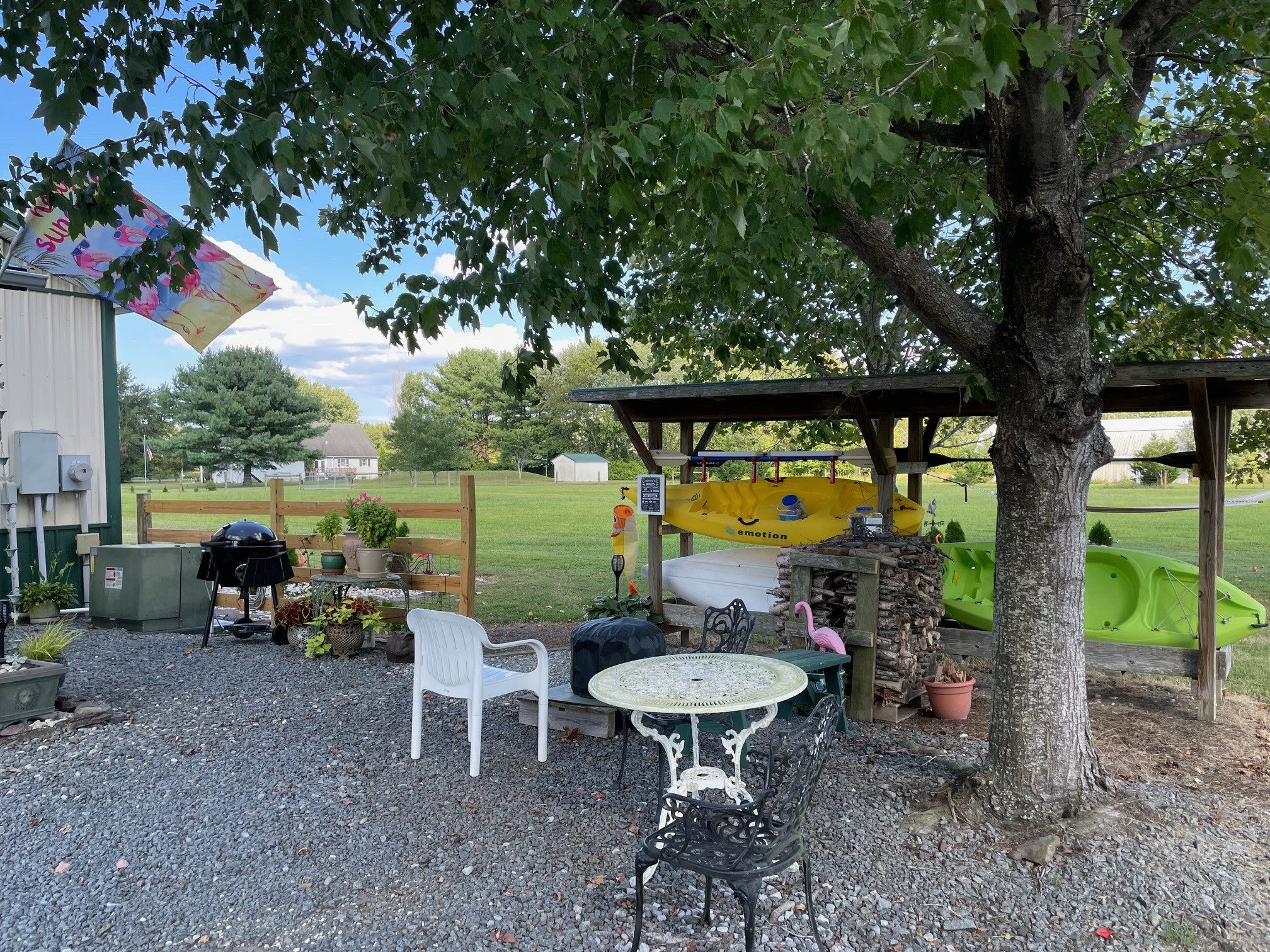 Dry Camping with Charm Near Lewes & Rehoboth Parked and ready to relax? You’ve landed in a peaceful, secure slice of DE, just minutes from beaches.  Have a bite to eat under the shade of a maple tree.

Note: water hydrant in next to the barbecue and plug 
          50 amp service on the barn corner to the left just out of the picture.
