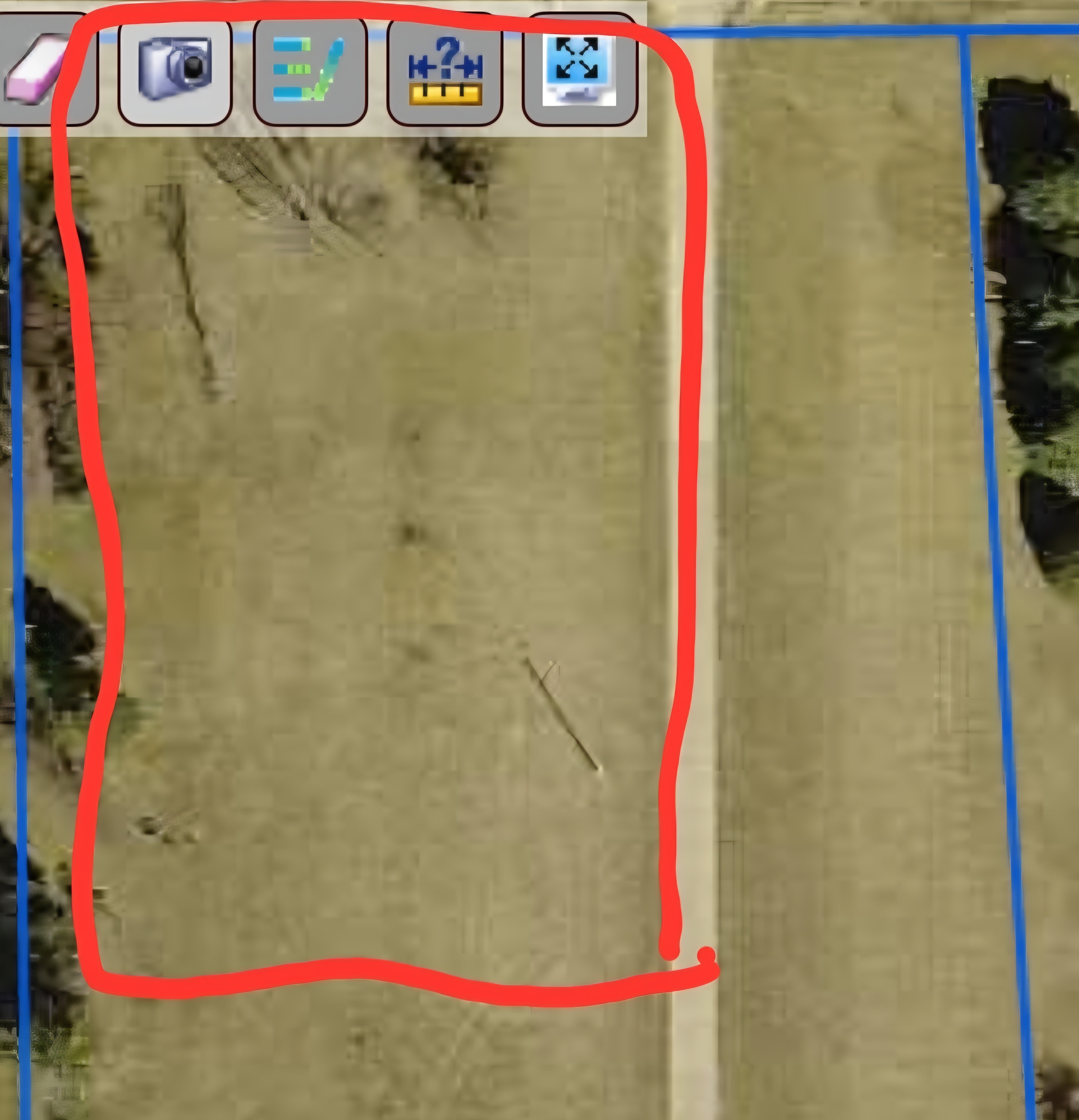 Front half of distance between yellow house and road